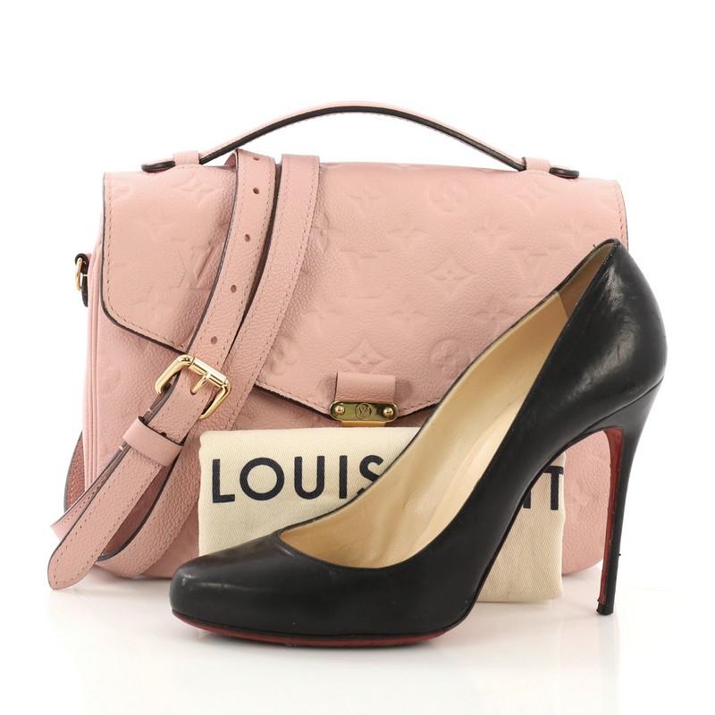 This Louis Vuitton Pochette Metis Monogram Empreinte Leather, crafted in pink monogram empreinte leather, features leather top handle, exterior back zip pocket, and gold-tone hardware. Its S-lock closure opens to a pink fabric interior with two open