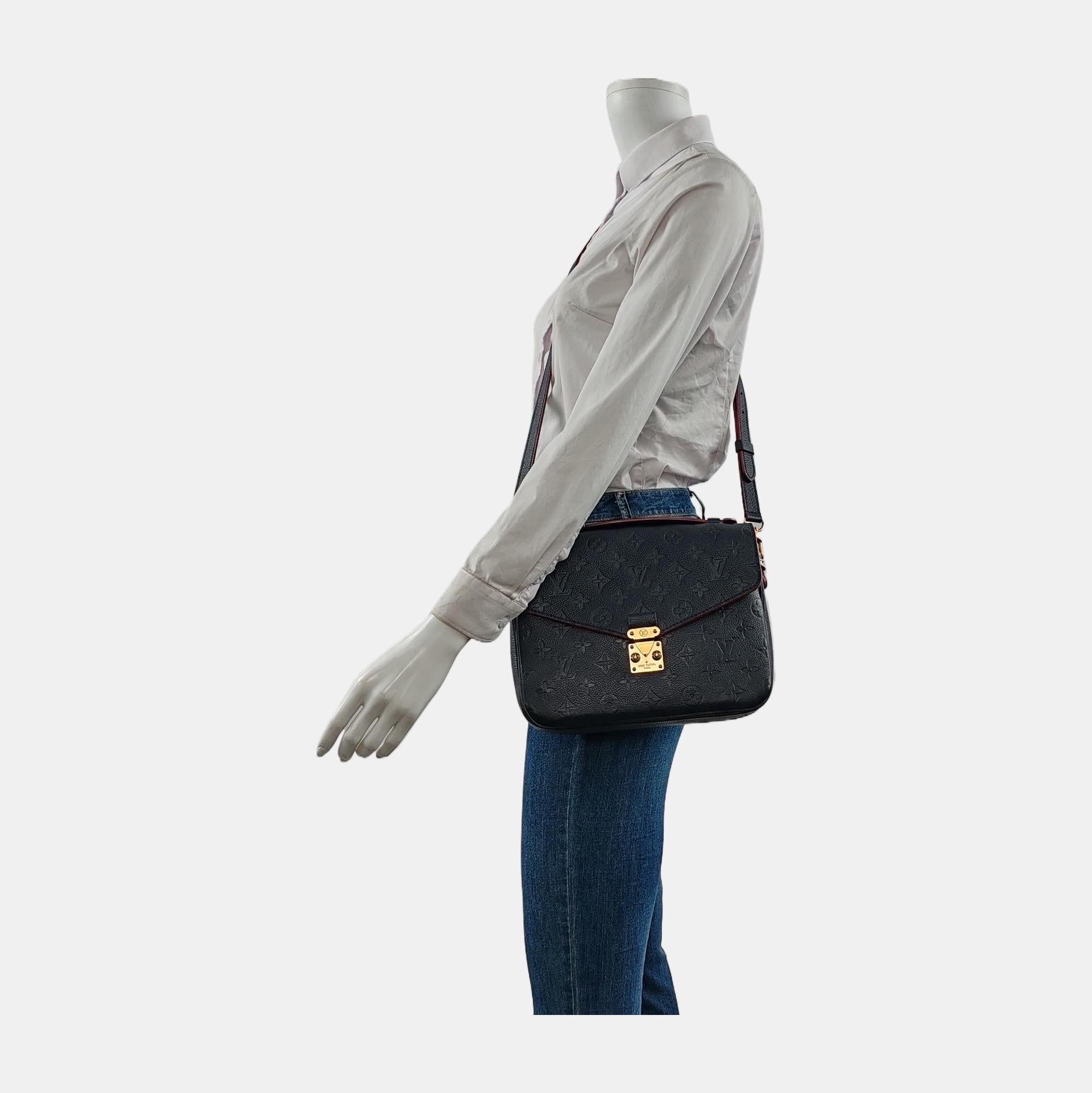Made from supple Monogram Empreinte leather and featuring an S-lock closure, the Louis Vuitton Pochette Métis is a sought-after bag known for its versatility and spaciousness despite its compact size. Its elegant design is a modern take on the