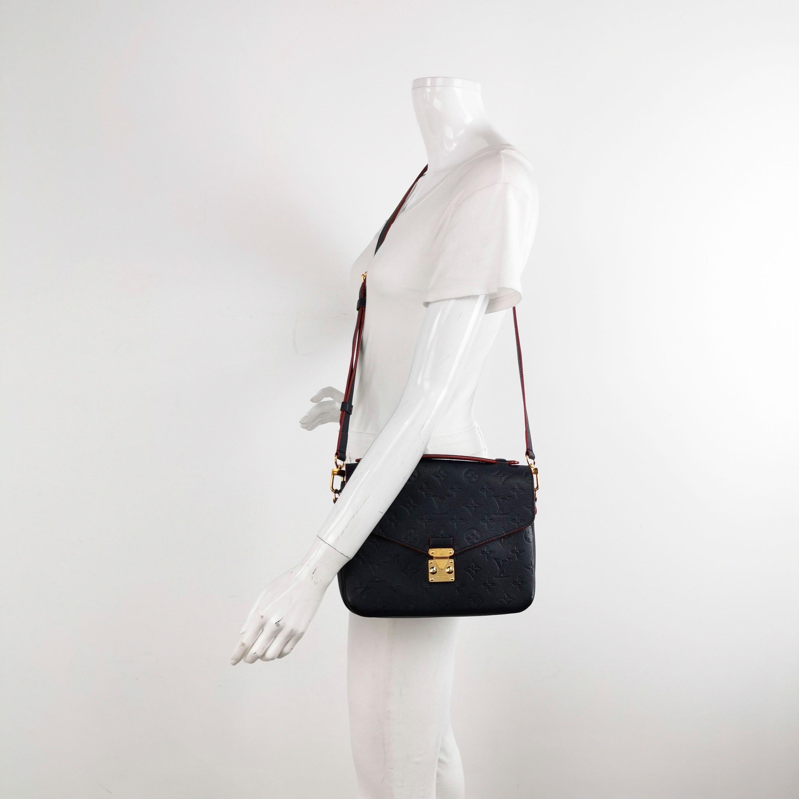 Made from supple Monogram Empreinte leather and featuring an S-lock closure, the Louis Vuitton Pochette Métis is a sought-after bag known for its versatility and spaciousness despite its compact size. Its elegant design is a modern take on the
