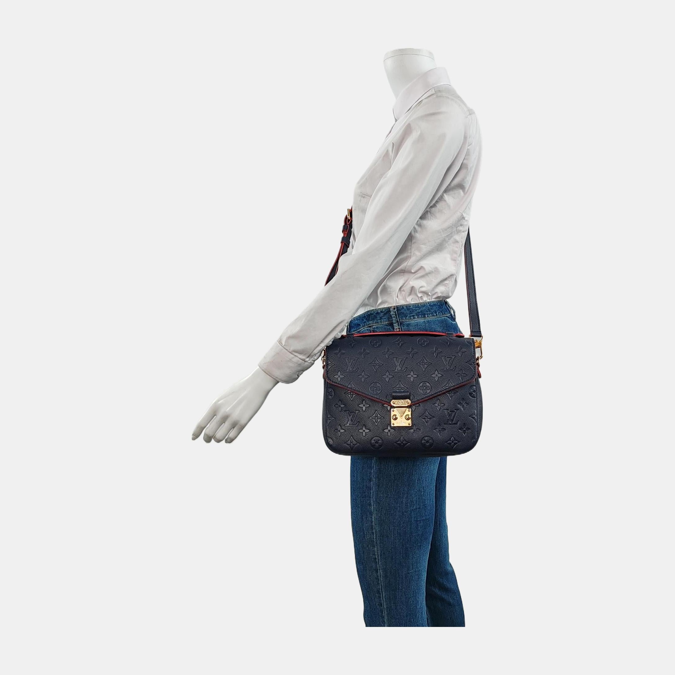 Made from supple Monogram Empreinte leather and featuring an S-lock closure, the Louis Vuitton Pochette Métis is a sought-after bag known for its versatility and spaciousness despite its compact size. Its elegant design is a modern take on the