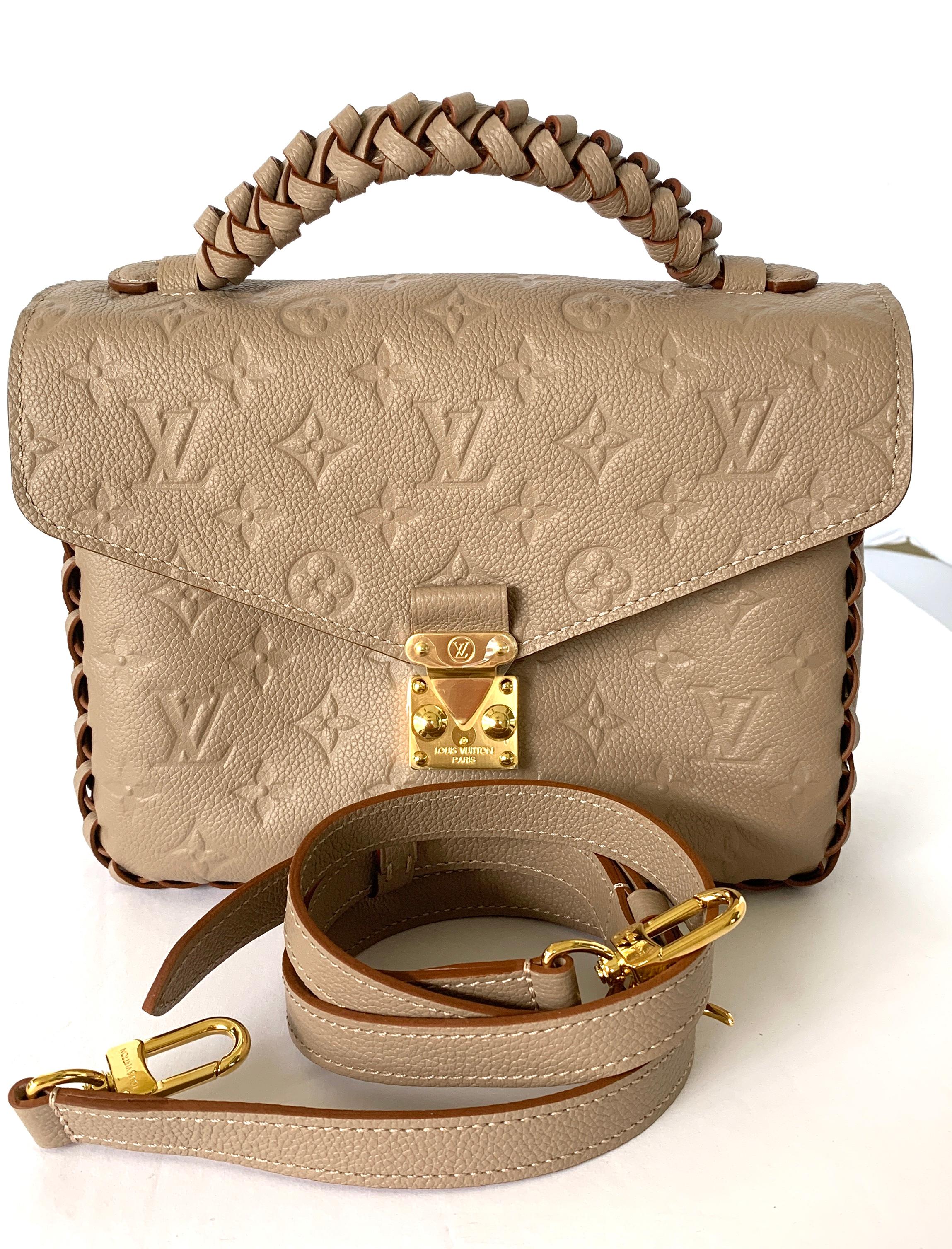 Louis Vuitton Pochette Metis Monogram Empreinte LeatherLouis Vuitton 
M43941
METIS POCHETTE
EMPRIENTE LEATHER
BRAIDED HANDLE
COLOR IS VISION

 
 
 

(Length x Height x Width) 
L 9.8 x H 7.5 x W 2.8 inches
Vison Beige
Embossed supple grained cowhide