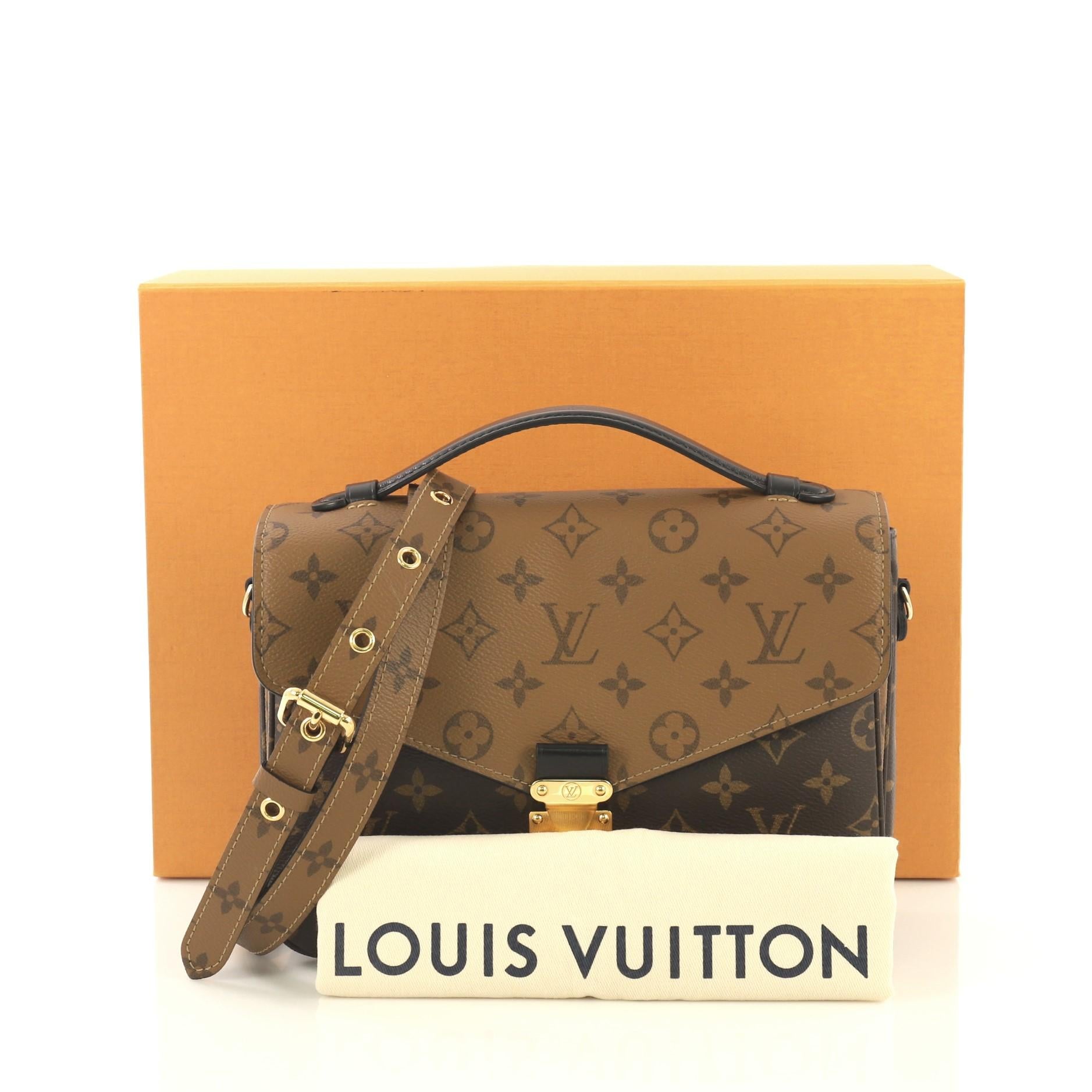 This Louis Vuitton Pochette Metis Reverse Monogram Canvas, crafted from brown reverse monogram coated canvas, features a top leather handle, exterior back zip pocket, and gold-tone hardware. Its S-lock closure opens to a black microfiber interior