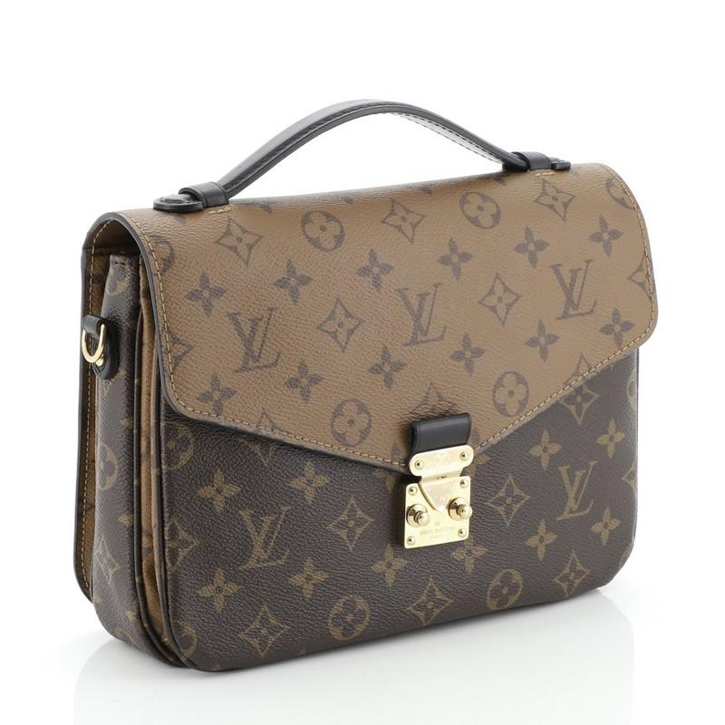 This Louis Vuitton Pochette Metis Reverse Monogram Canvas, crafted from brown reverse monogram coated canvas, features a top leather handle, exterior back zip pocket, and gold-tone hardware. Its S-lock closure opens to a black microfiber interior
