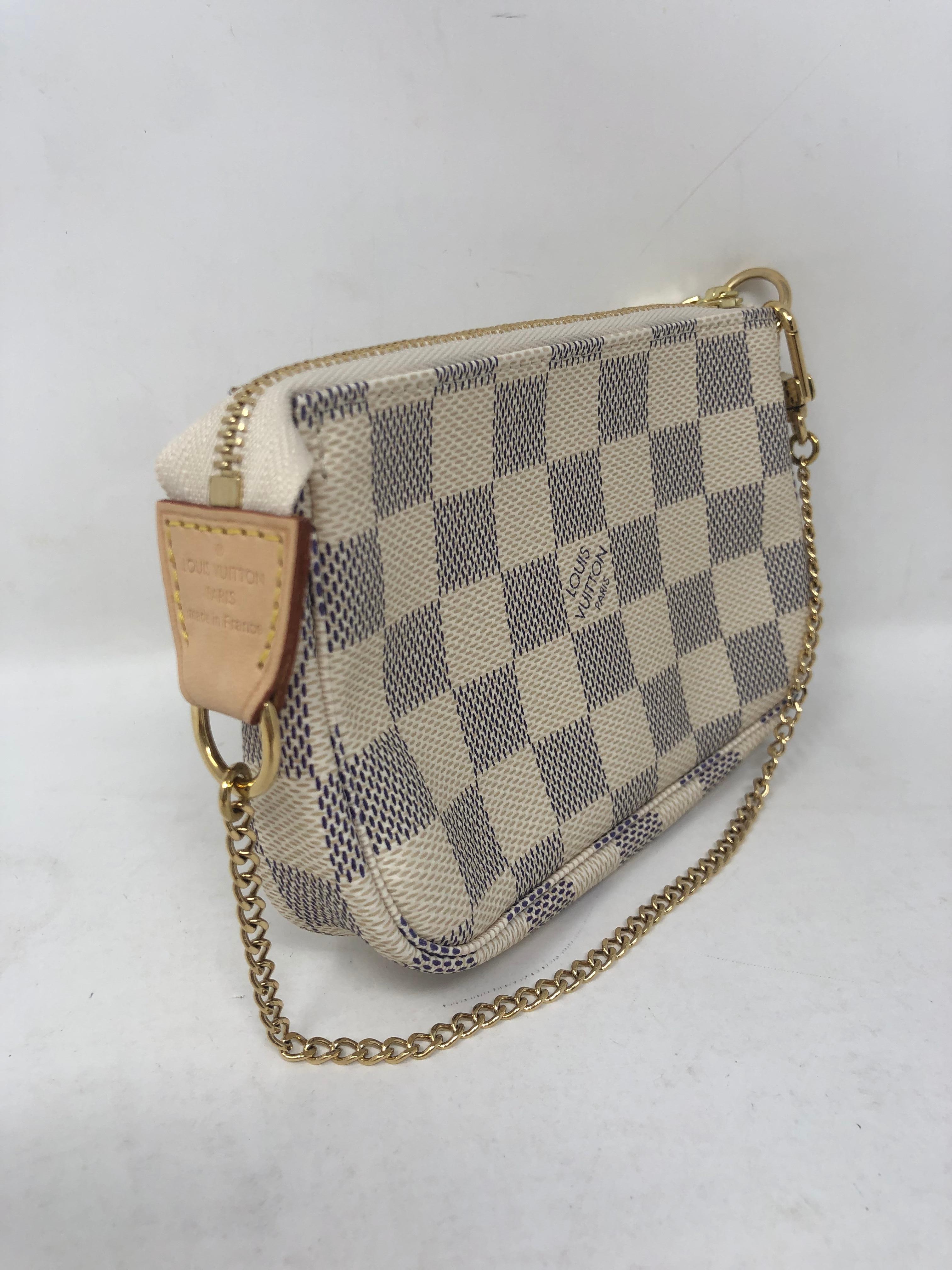 Louis Vuitton Pochette Mini with chain. Damier Azure pattern. Brand new and sold out at LV. This mini clutch is the perfect little accessory. Includes dust cover and box. Guaranteed authentic. 