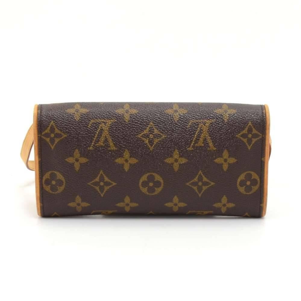 Louis Vuitton Twin Pochette PM in monogram canvas. The front flap has a magnetic closure. It can be carried as a clutch or a shoulder bag with a detachable natural cowhide leather strap.  SKU: LP127

Made in: France
Serial Number: CA1010
Size: 7.5 x