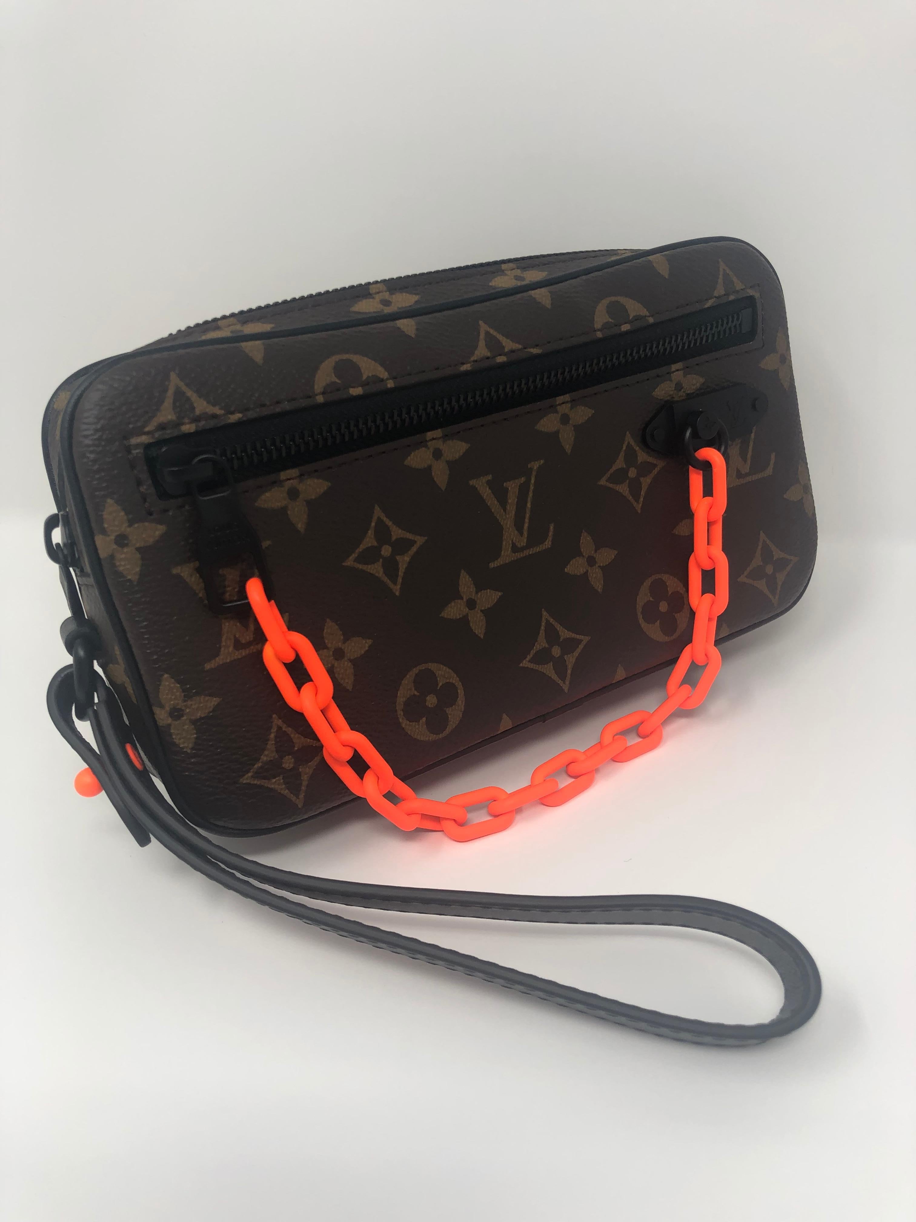 Louis Vuitton Pochette Volga. Designed by Virgil Abloh for his first collection at LV. Versatile bag that can be worn as a clutch or wallet. Handle can be removed. Brand new and limited. Includes dust cover and box. Guaranteed authentic. 