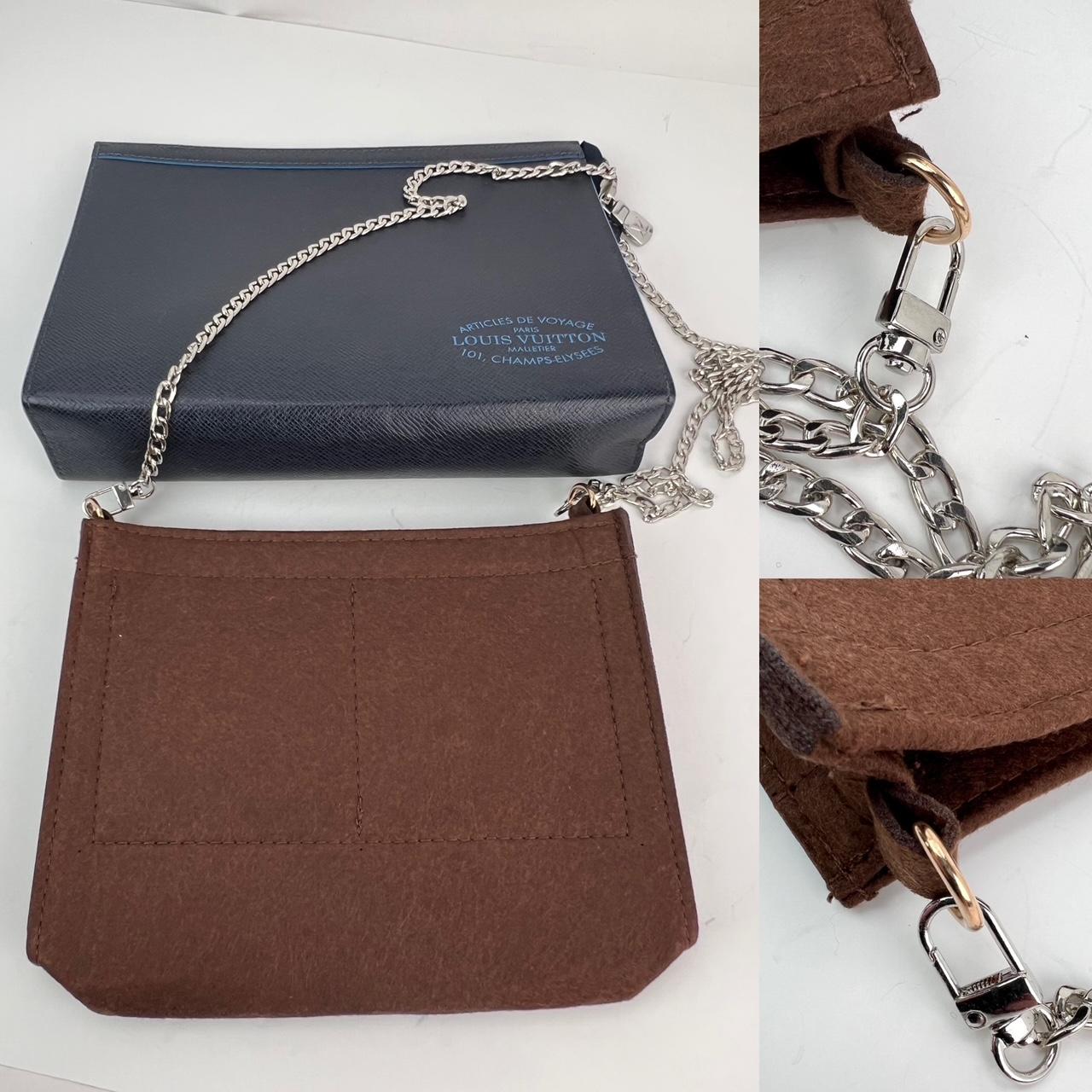 Pre-Owned  100% Authentic
Louis Vuitton Pochette Voyage MM Taiga Dark Blue Leather Hand Bag Limited Edition
Unisex bag Men use as a Clutch/Wallet has 6 Credit card Slots. Or women use as a 
crossbody with the enclosed insert and unbranded strap
If