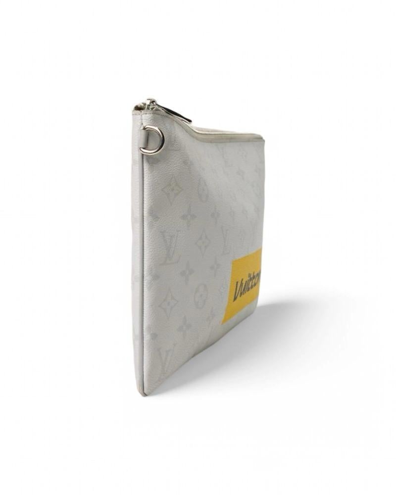 Louis Vuitton signature clutch bag, Voyage model designed by Virgil Abloh Chalk Logo Story collection. Made of white leather in tone-on-tone monogram pattern with silver hardware. Features a zippered top closure, canvas and leather lined interior