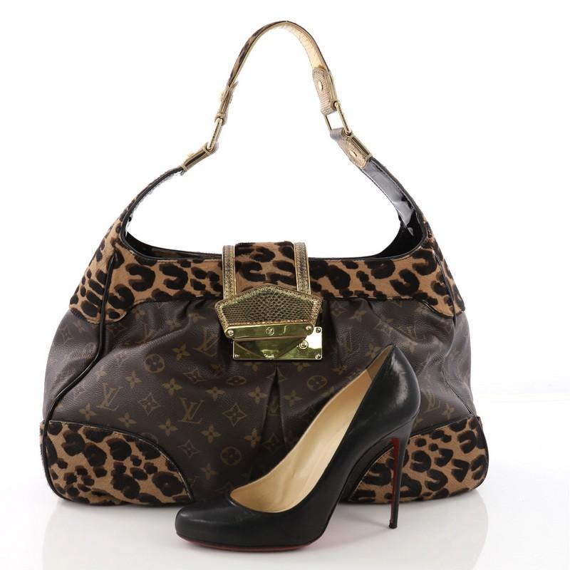 This Louis Vuitton Polly Handbag Limited Edition Monogram Canvas and Pony Hair, crafted from brown monogram coated canvas and leopard print pony hair, features a karung watersnake leather shoulder strap and trims, pleated design at front and back,