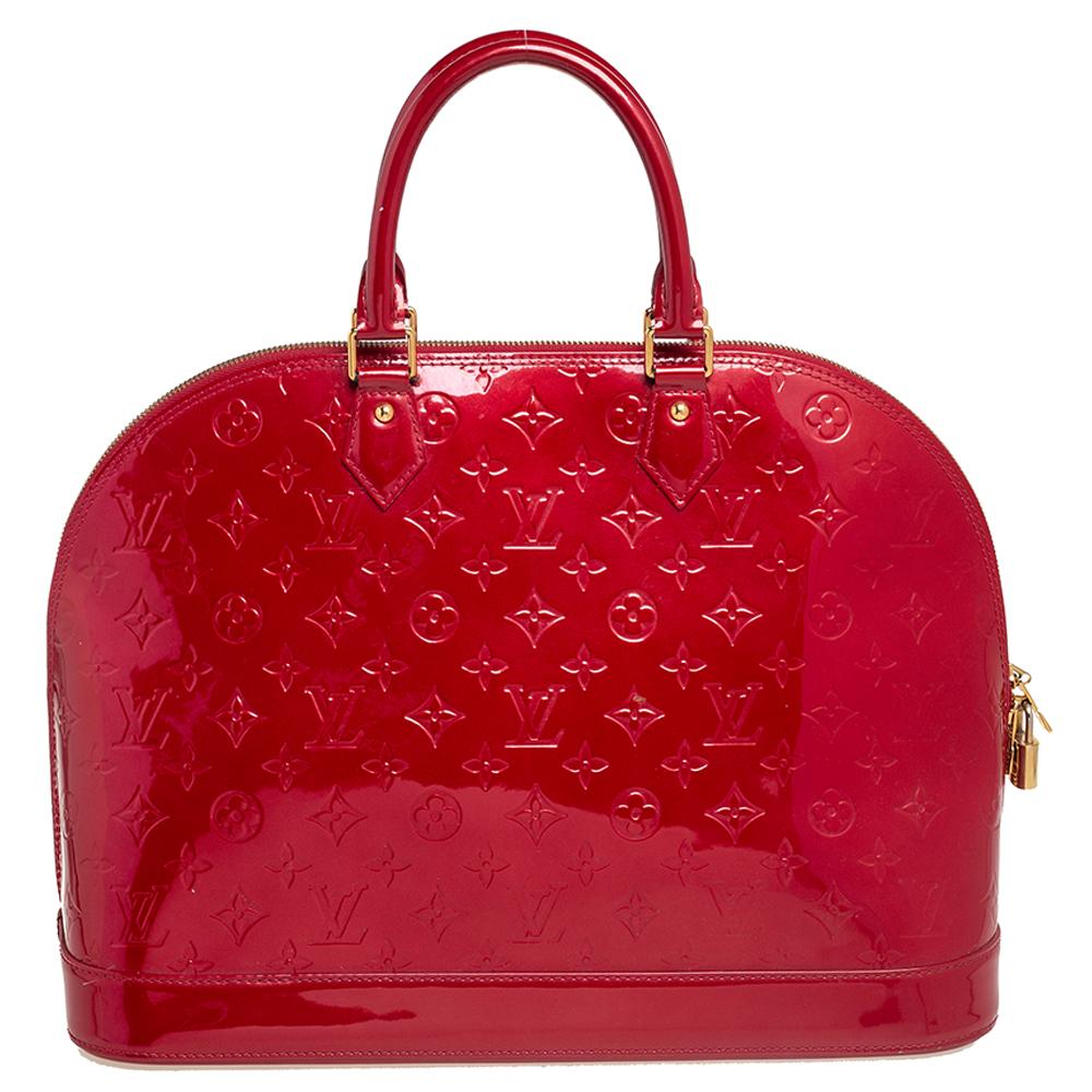 The Louis Vuitton Alma is a classic that has received love from icons. This piece comes crafted from Monogram Vernis, featuring double zippers with a padlock and a fabric interior. Two rolled handles are provided for you to swing it. Every closet