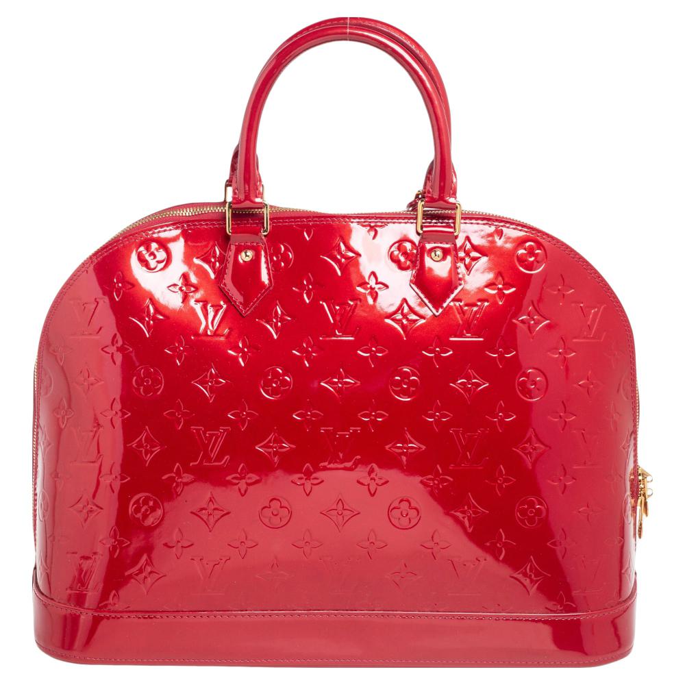 The Louis Vuitton Alma is a classic that has received love from icons. This piece comes crafted from Monogram Vernis, featuring double zippers with a padlock and a fabric interior. Two rolled handles are provided for you to swing it. Every closet