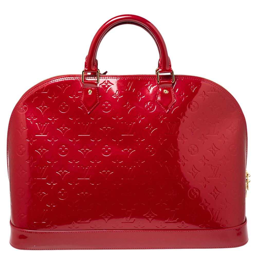 The Louis Vuitton Alma is a classic that has received love from icons. This piece comes crafted from Monogram Vernis, featuring double zippers with a padlock and a canvas interior. Two rolled handles are provided for you to swing it. Every closet