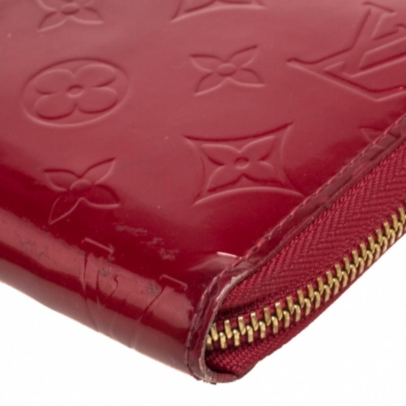 This Louis Vuitton Zippy wallet is conveniently designed for everyday use. Crafted from Monogram Vernis, the wallet has a wide zip closure that opens to reveal multiple slots, leather-lined compartments, and a zip pocket for you to neatly arrange