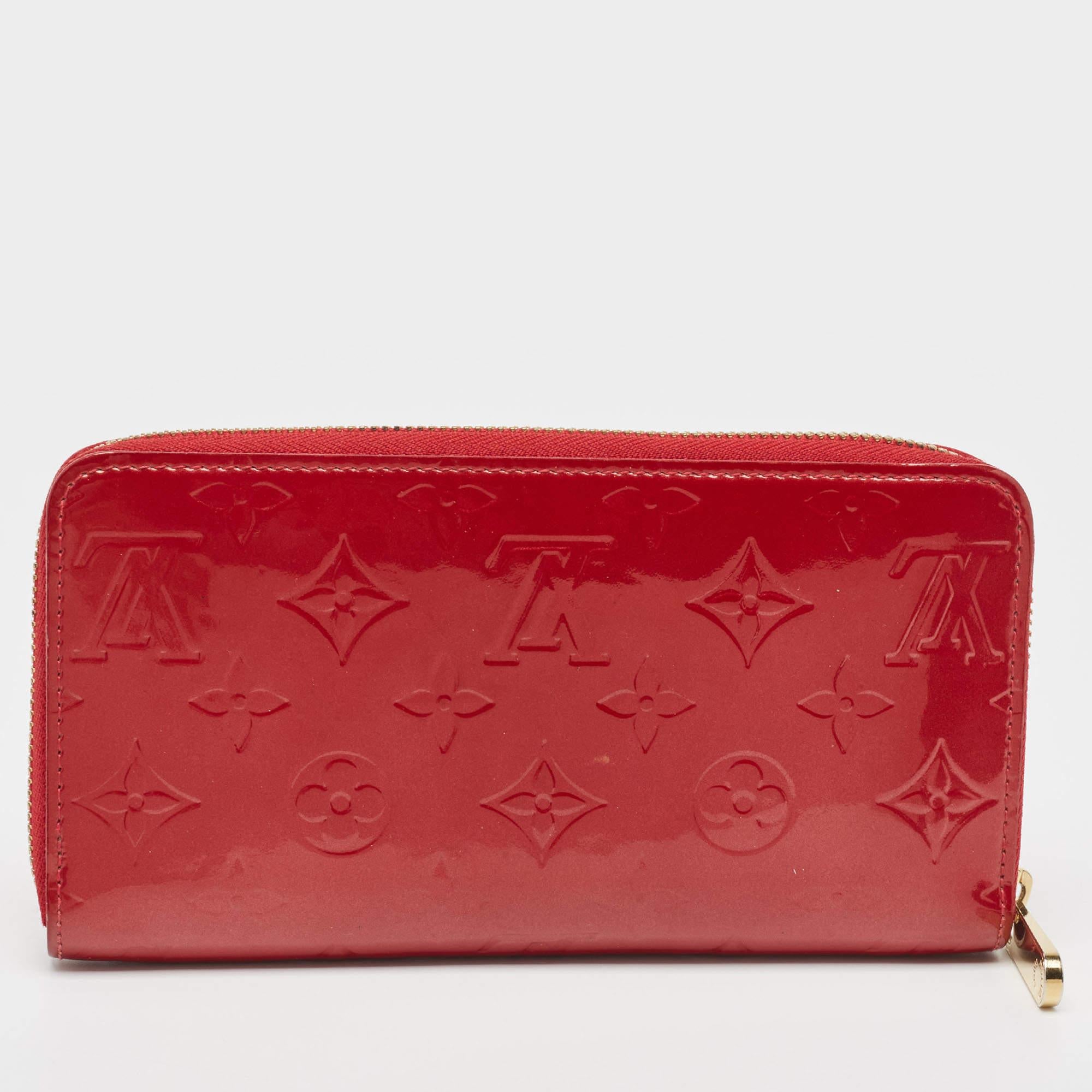This Louis Vuitton Zippy wallet is conveniently designed for everyday use. Crafted from Pomme D’amour Monogram Vernis, the wallet has a wide zip closure that opens to reveal multiple slots, leather-lined compartments, and a zip pocket for you to