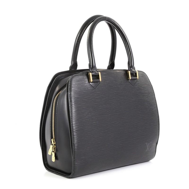 This Louis Vuitton Pont Neuf Handbag Epi Leather PM, crafted from black epi leather, features dual rolled leather handles, slip compartments at the front and back, and gold-tone hardware. Its zip closure opens to a gray microfiber interior with zip