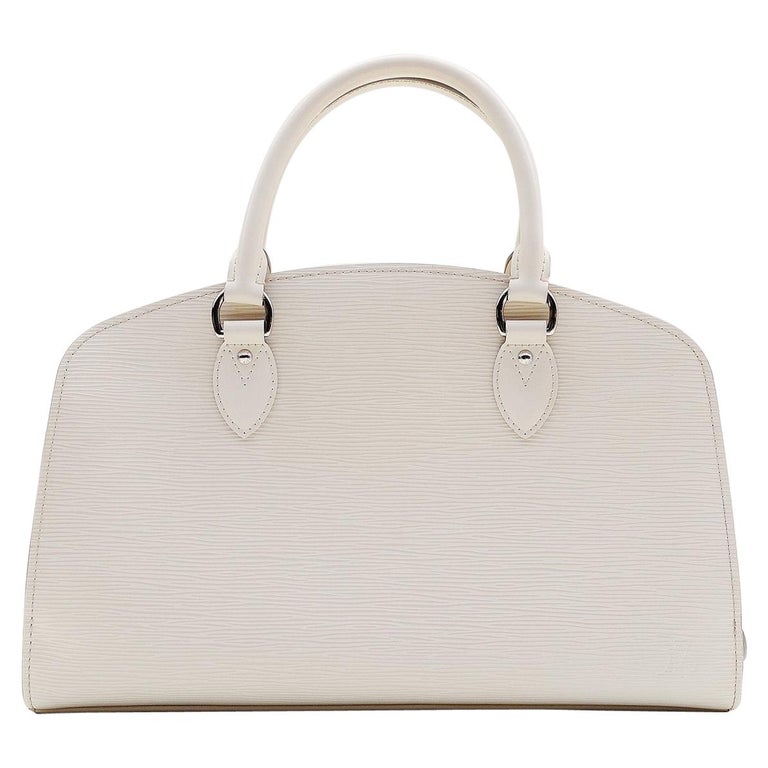 Louis Vuitton Pont Neuf PM Epi Leather Ivory Handbag at 1stDibs  pont neuf  handbag epi leather pm, lv dust bag fake vs real, louis vuitton ivory  handbag