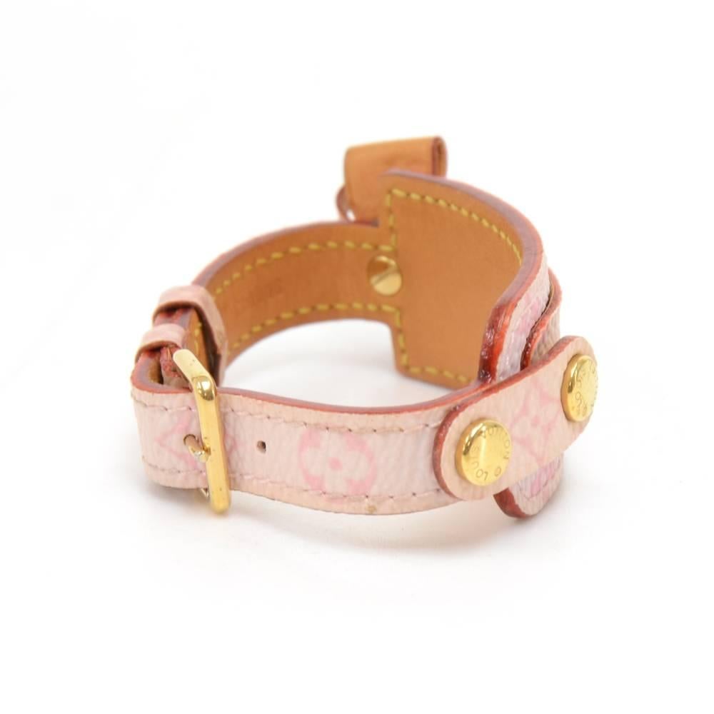 Louis Vuitton Porte-Adresse bracelet in pink monogram canvas and cowhide leather. It has a cute leather ribbon and a thin flap where you can discretely keep a slip of paper for your address/name tag. Adjustable and light weight. It is discontinued