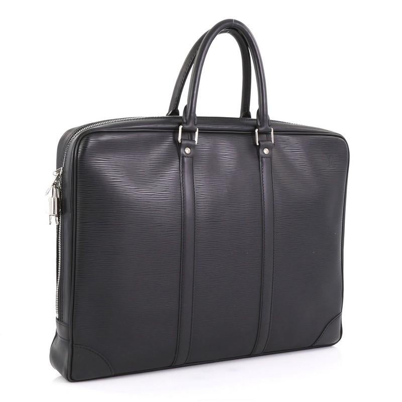 This Louis Vuitton Porte-Documents Voyage Briefcase Epi Leather, crafted in black epi leather, features dual rolled handles, leather base corners, and silver-tone hardware. Its top zip closure opens to a black leather interior with side zip and slip