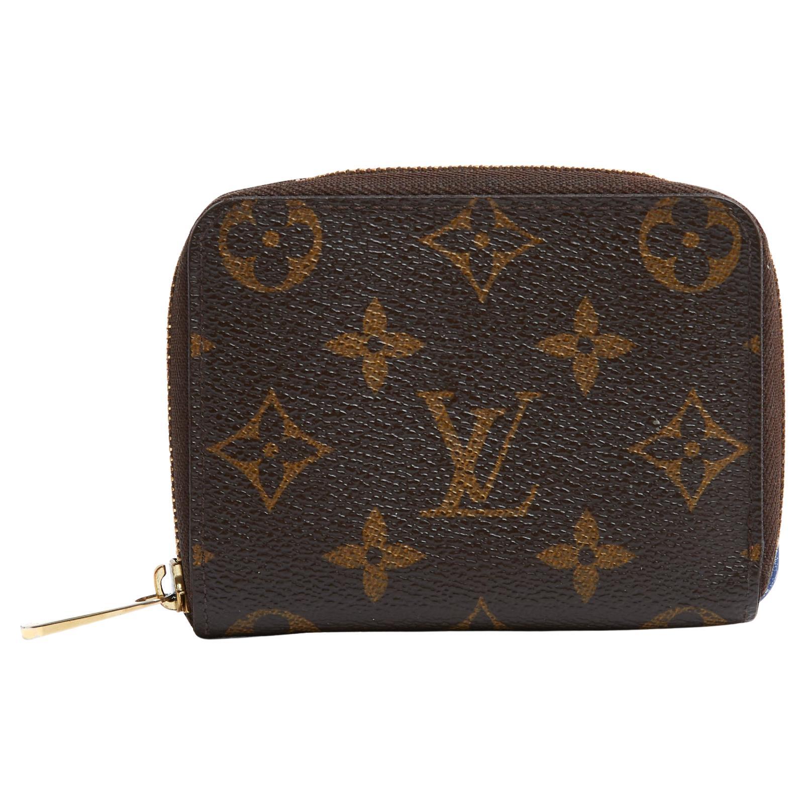 Louis Vuitton Porte monnaie Zippy LV Monogram and leather compact wallet