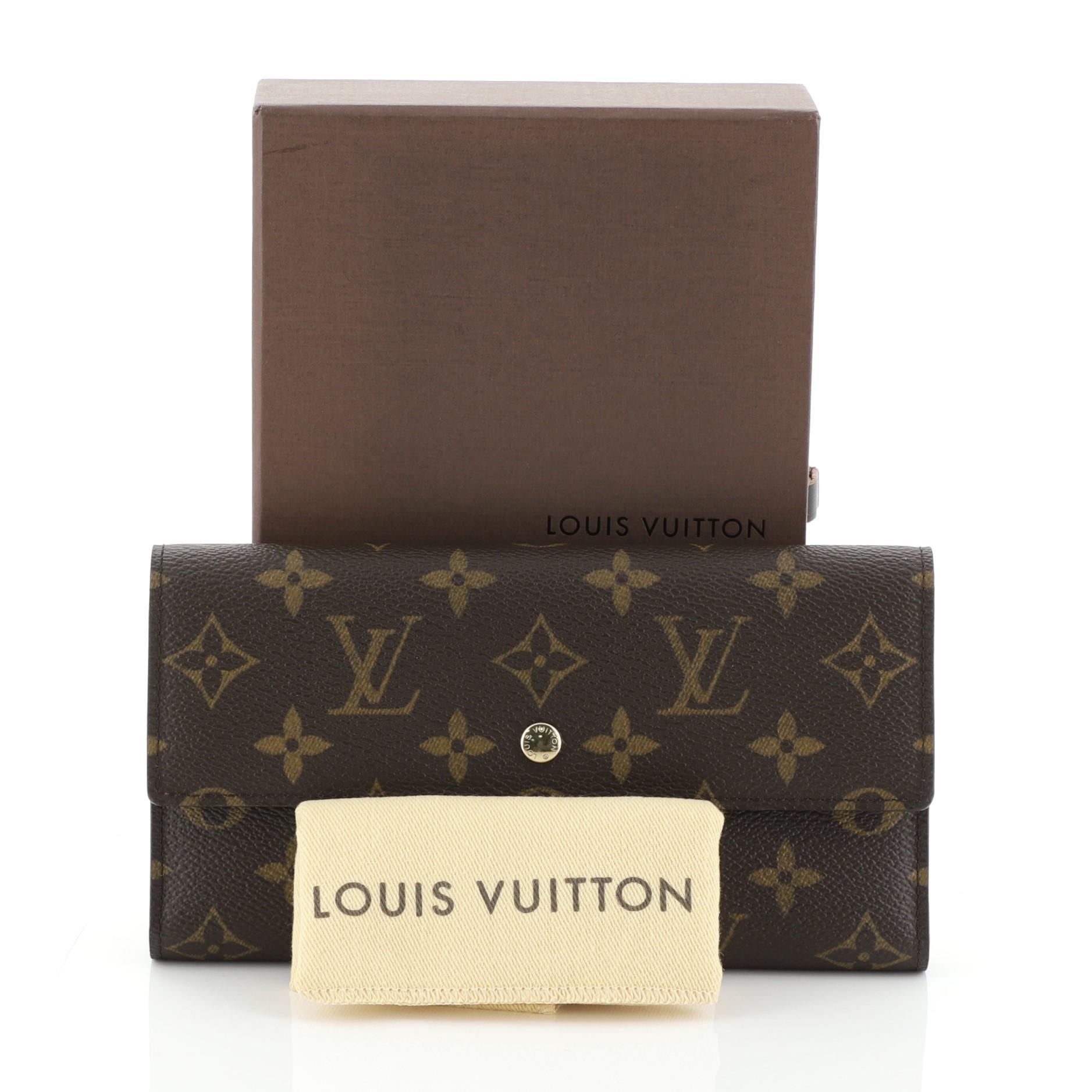 
This Louis Vuitton Porte Tresor International Wallet Monogram Canvas, crafted from brown monogram coated canvas, features gold-tone hardware. Its snap closure opens to a brown leather interior with multiple card slots, long flat pockets, coin