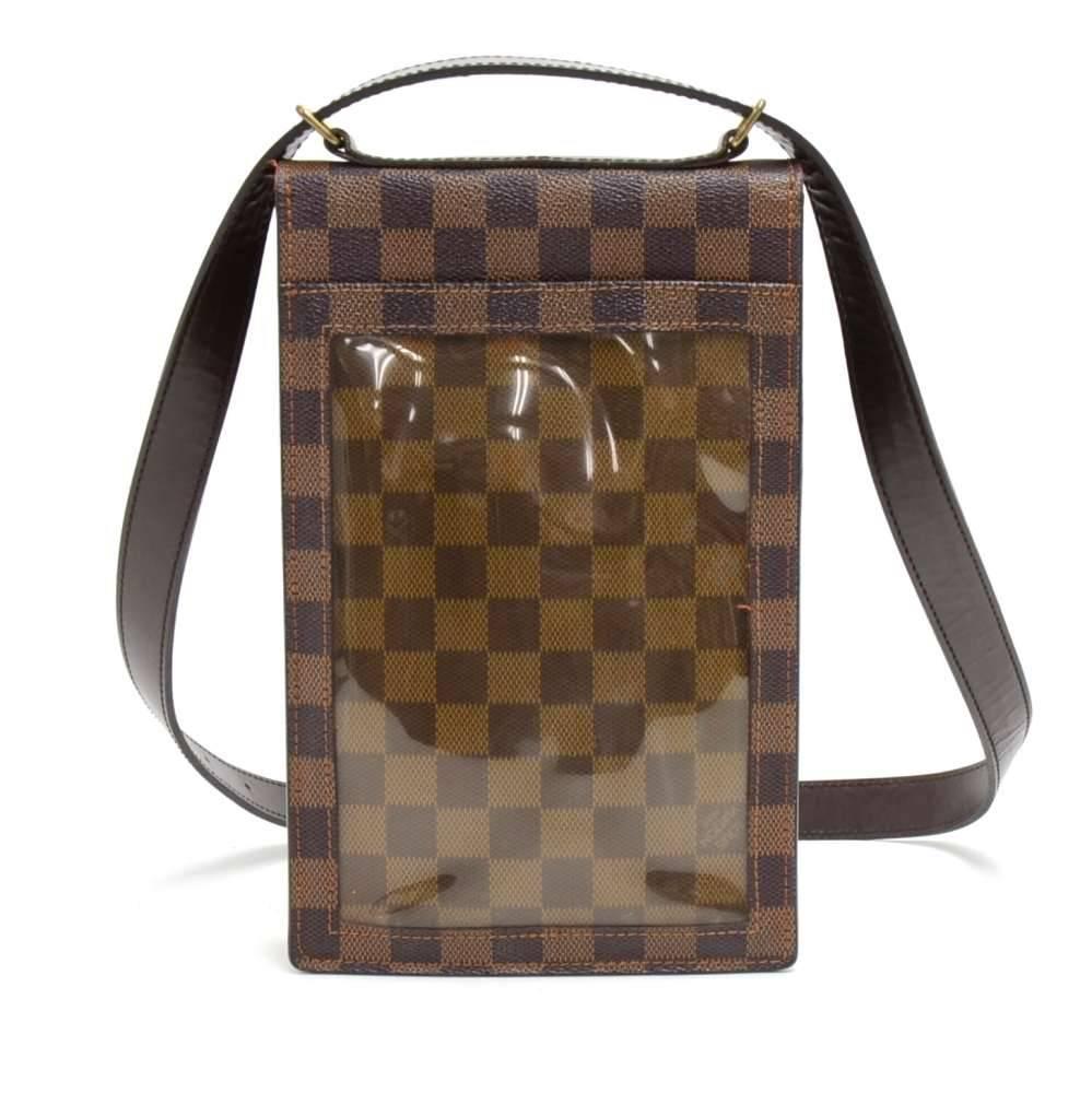 Louis Vuitton Portobello crossbody bag in Damier Ebene canvas. It is beautiful design with a clear vinyl slip pocket on the back. Flap top is secured with 2 stud button closures. Under the flap, there are there are 3 pen holders and one slip pocket.