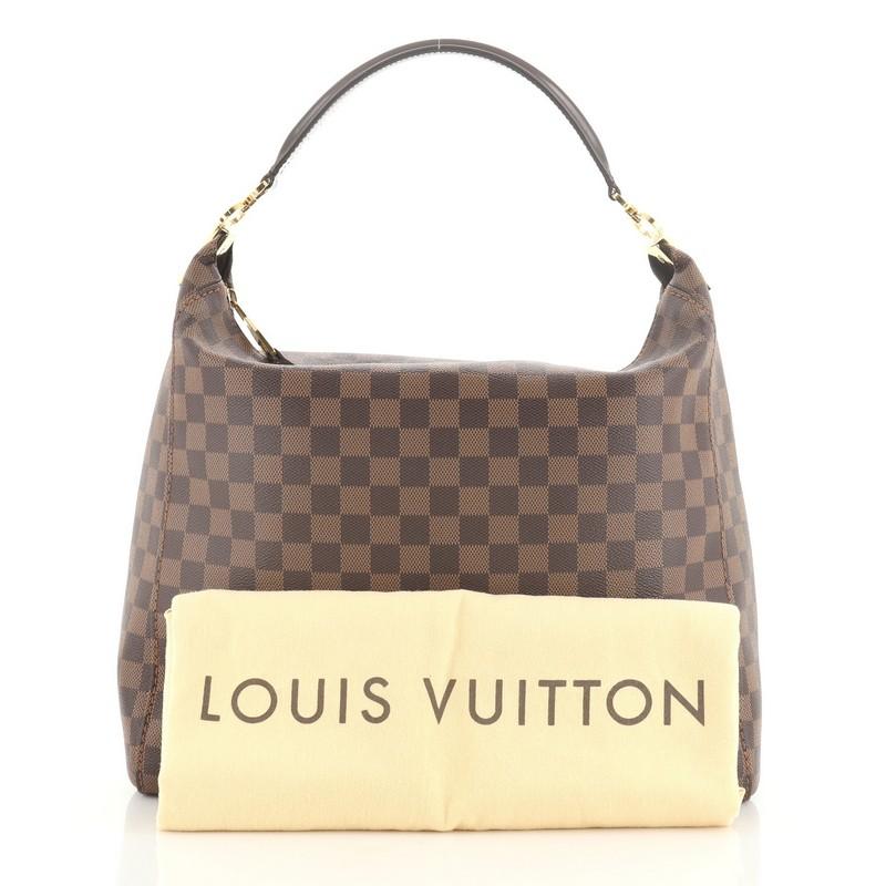 This Louis Vuitton Portobello Handbag Damier GM, crafted in damier ebene coated canvas, features a single looped leather handle and gold-tone hardware. Its zip closure opens to a brown microfiber interior with side zip and slip pockets. Authenticity