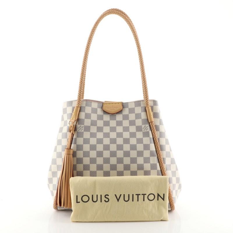 This Louis Vuitton Propriano Handbag Damier, crafted from damier azur coated canvas, features dual braided shoulder straps, natural cowhide leather trim, leather tassel, press-studs on both sides, protective base studs and gold-tone hardware. Its