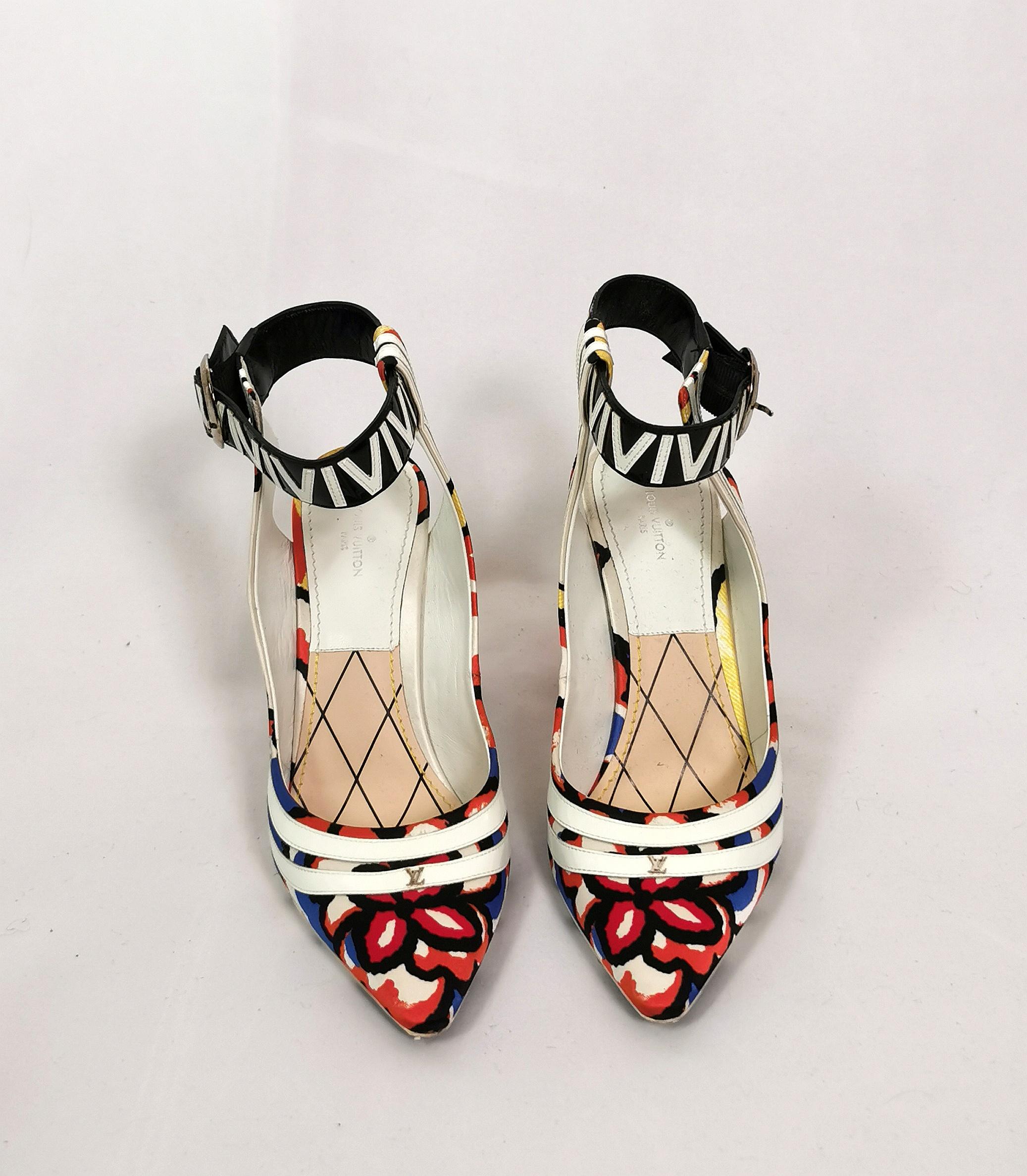 A fun and rare sold out model from Louis Vuitton's 2015 Cruise collection.

A colourful floral, graffiti style print on white canvas with chunky 70s esque block heels and a wide, patent monochrome ankle strap.

Pointed toe with the LV logo in silver