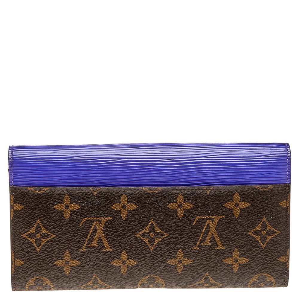 The House of Louis Vuitton creates this beautiful Marie-Lou wallet by incorporating luxurious elements into its structure. Displaying the Monogram canvas and purple Epi leather on the exterior, this wallet adopts the signature beauty of the brand.