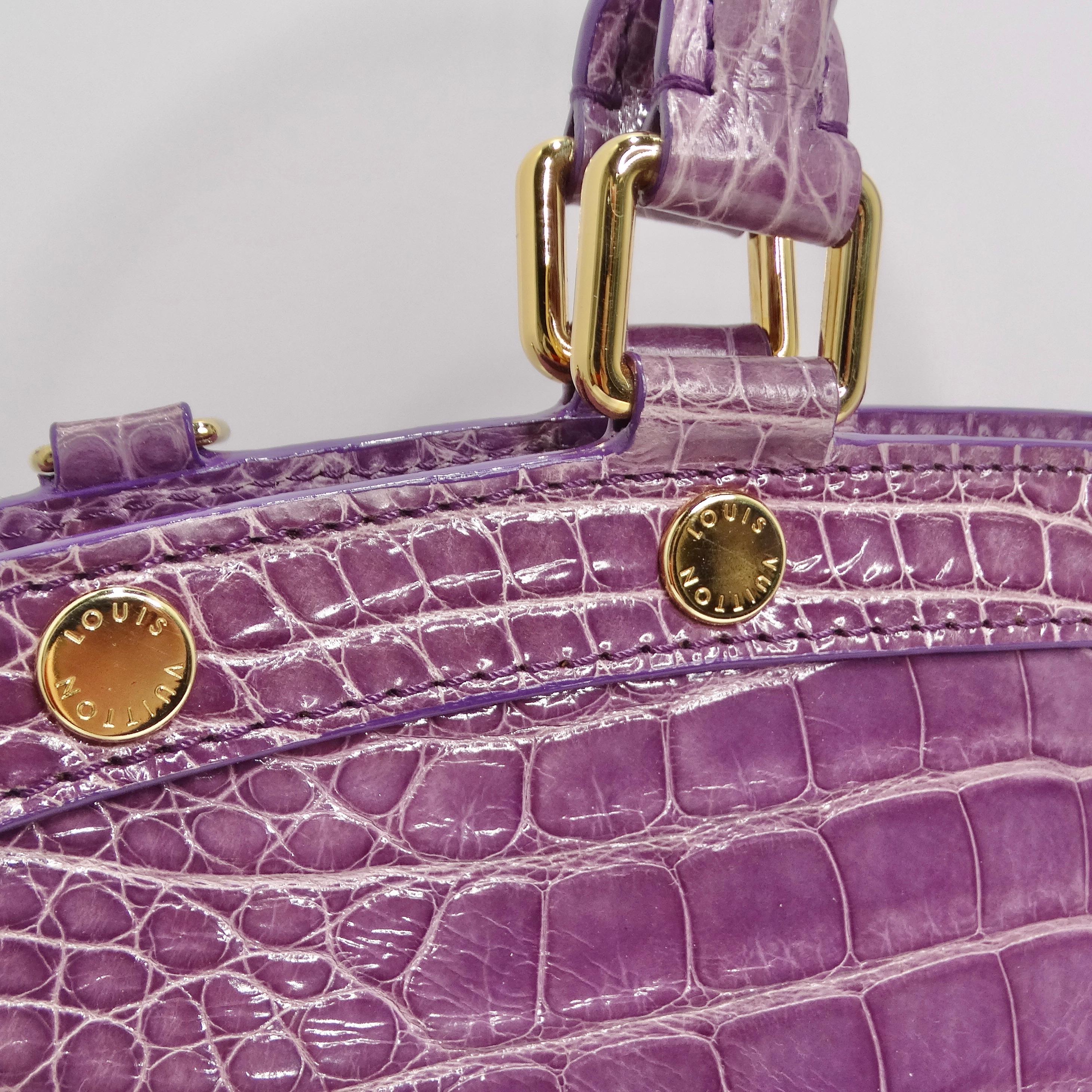 This is the most iconic and beautiful piece to add to your collection! A bag made to make a statement! This bag is vintage, made in 2001, and is perfect for the Louis Vuitton collector. It is featured in a beautiful and subtle but brilliant purple