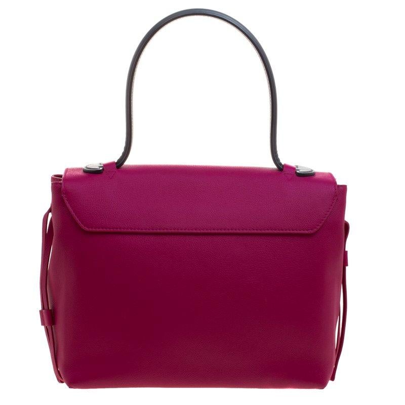 It is every woman's dream to own a Louis Vuitton handbag as appealing as this one. Crafted from purple leather, this bag features a single top handle and strings on the sides that can give you an adjustable size. While the front flap with the LV