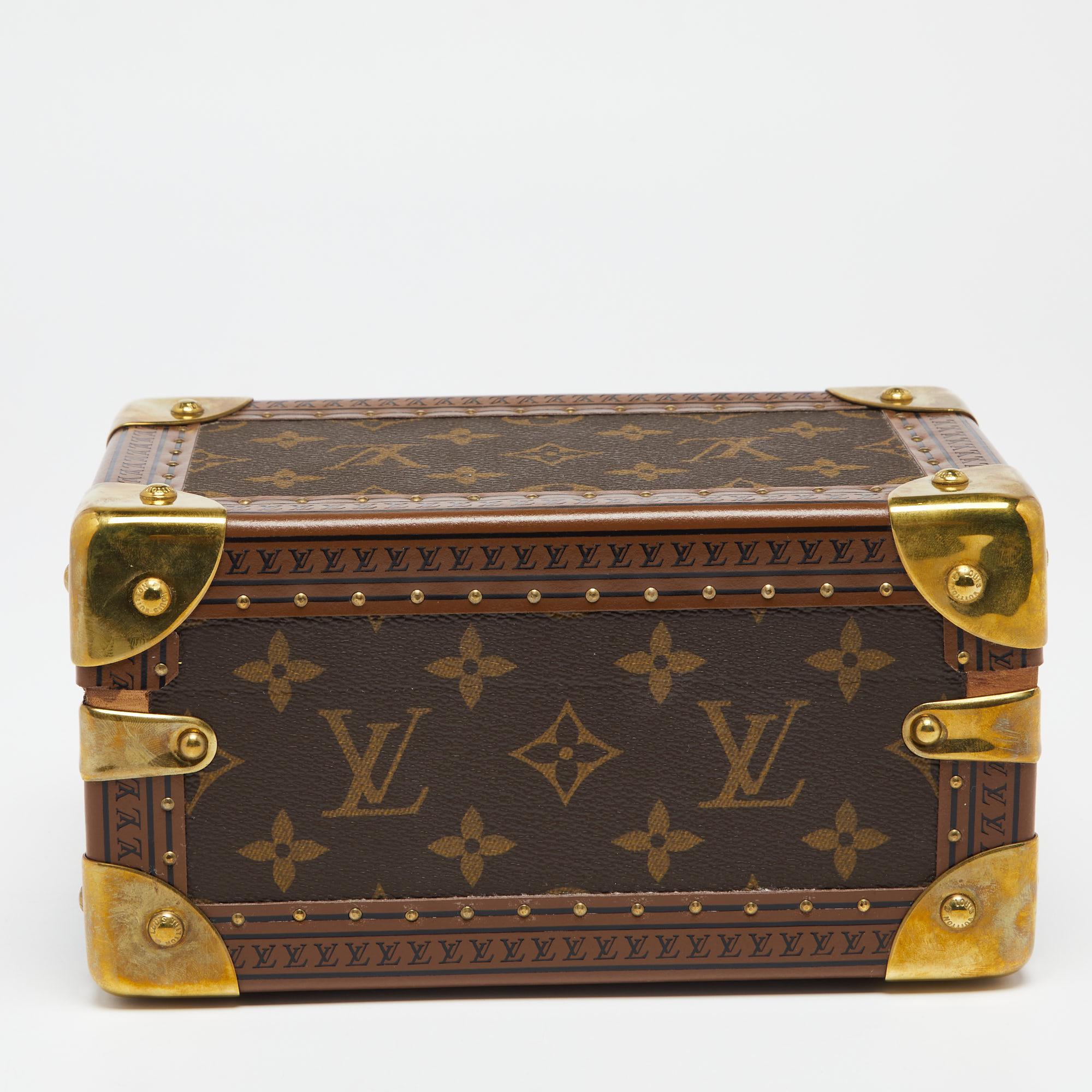 If you're looking for collectibles with a blend of classic style and exquisite craftsmanship, this Louis Vuitton jewelry box is the perfect piece! Crafted from monogram coated canvas, it is shaped beautifully like a trunk with a sturdy silhouette,