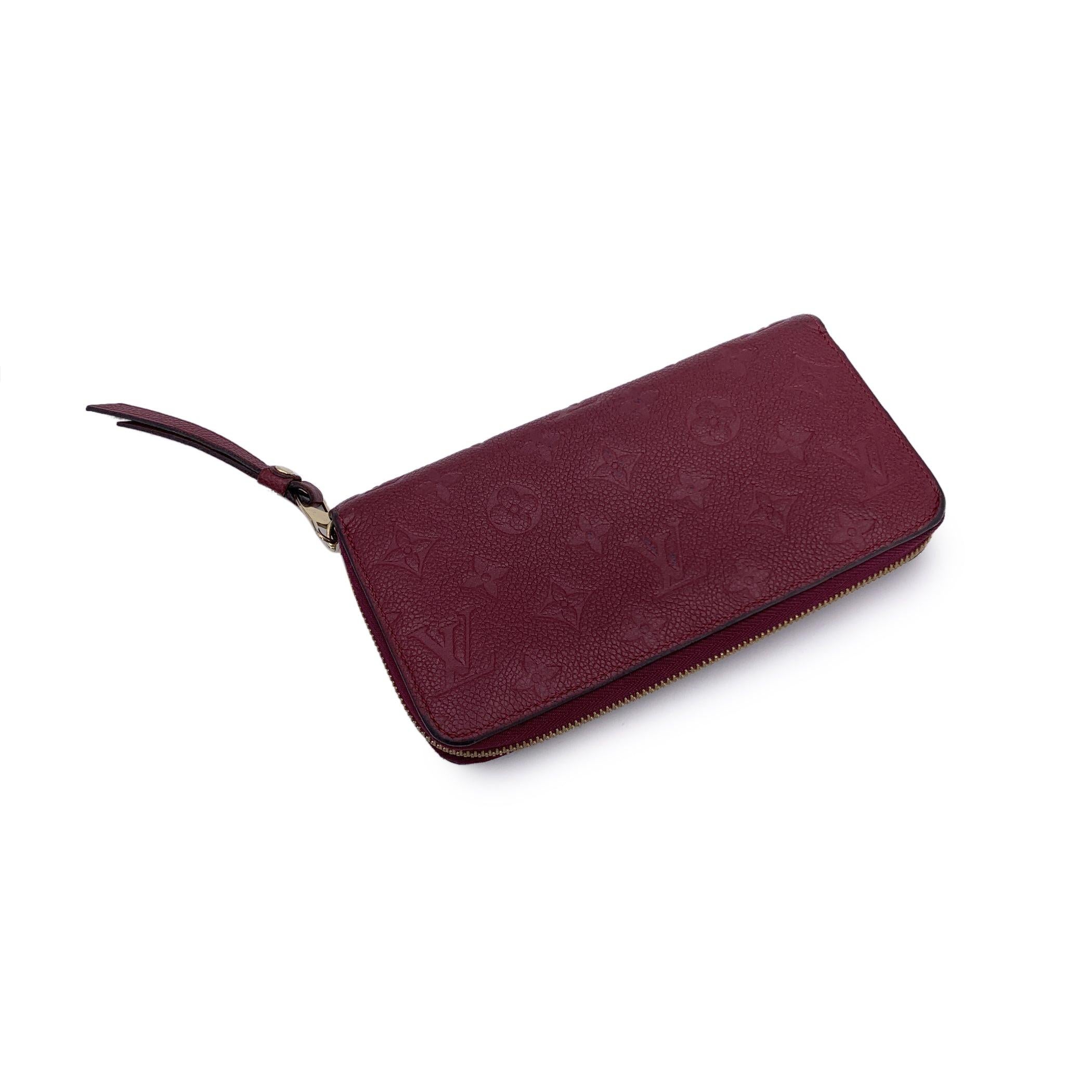 Nero Louis Vuitton Portafoglio lungo in pelle Monogram Empreinte viola con zip in vendita