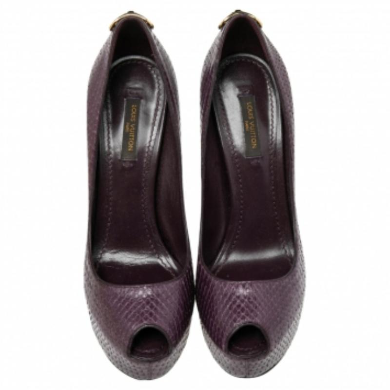 How splendid and glorious are these Oh Really! pumps from Louis Vuitton! Ravishing in purple, they come crafted from python leather and feature a peep-toe silhouette. They flaunt an artistic engraved gold-tone padlock detailing on the heel counters
