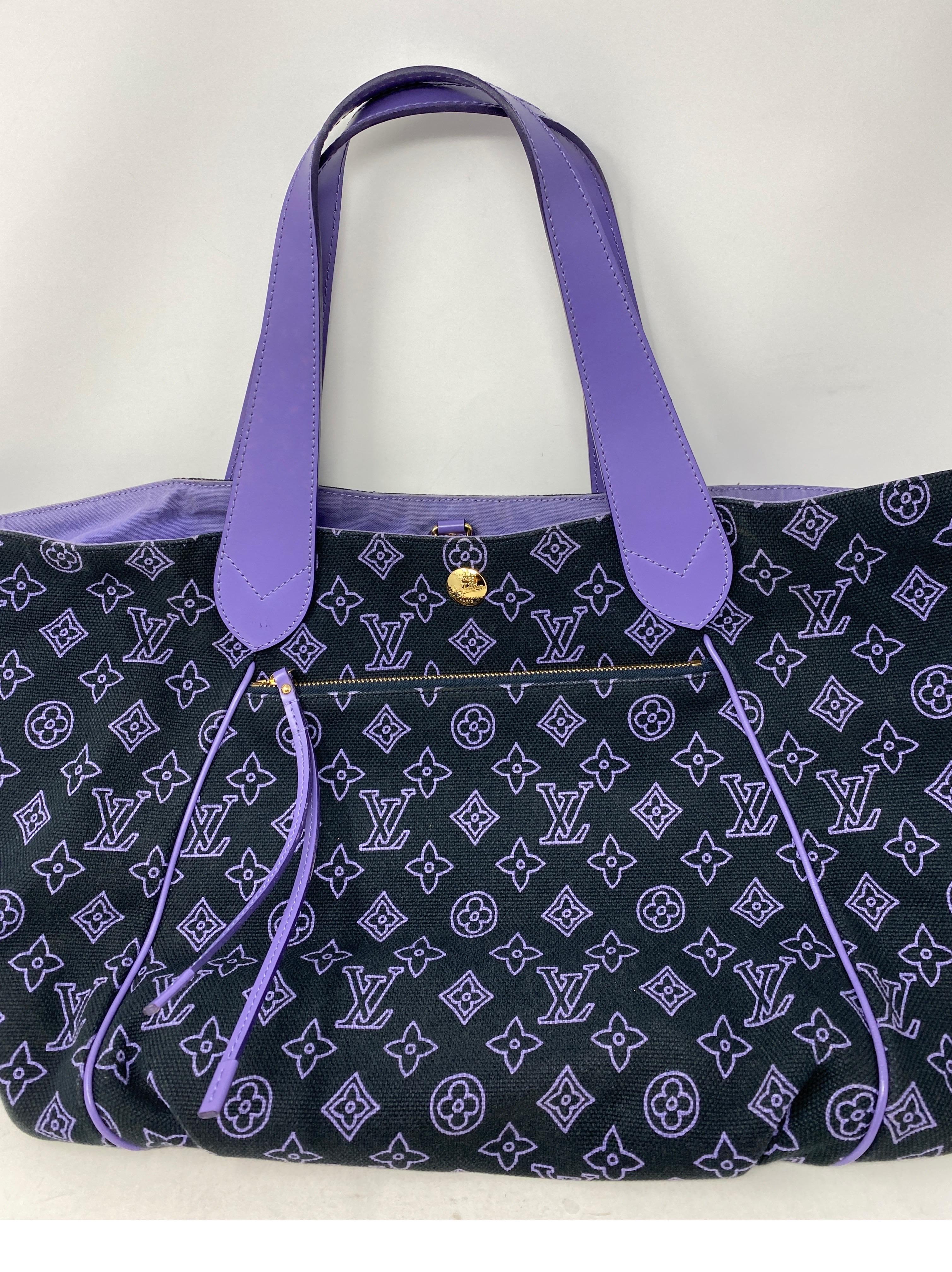 Louis Vuitton Purple Tote Bag. Cotton material with leather trim handles. Includes pouch. Unique LV bag for your collection. Overall good condition. Light tear on one side inside bag and on inside pocket. Please see photos. Gold hardware. Guaranteed