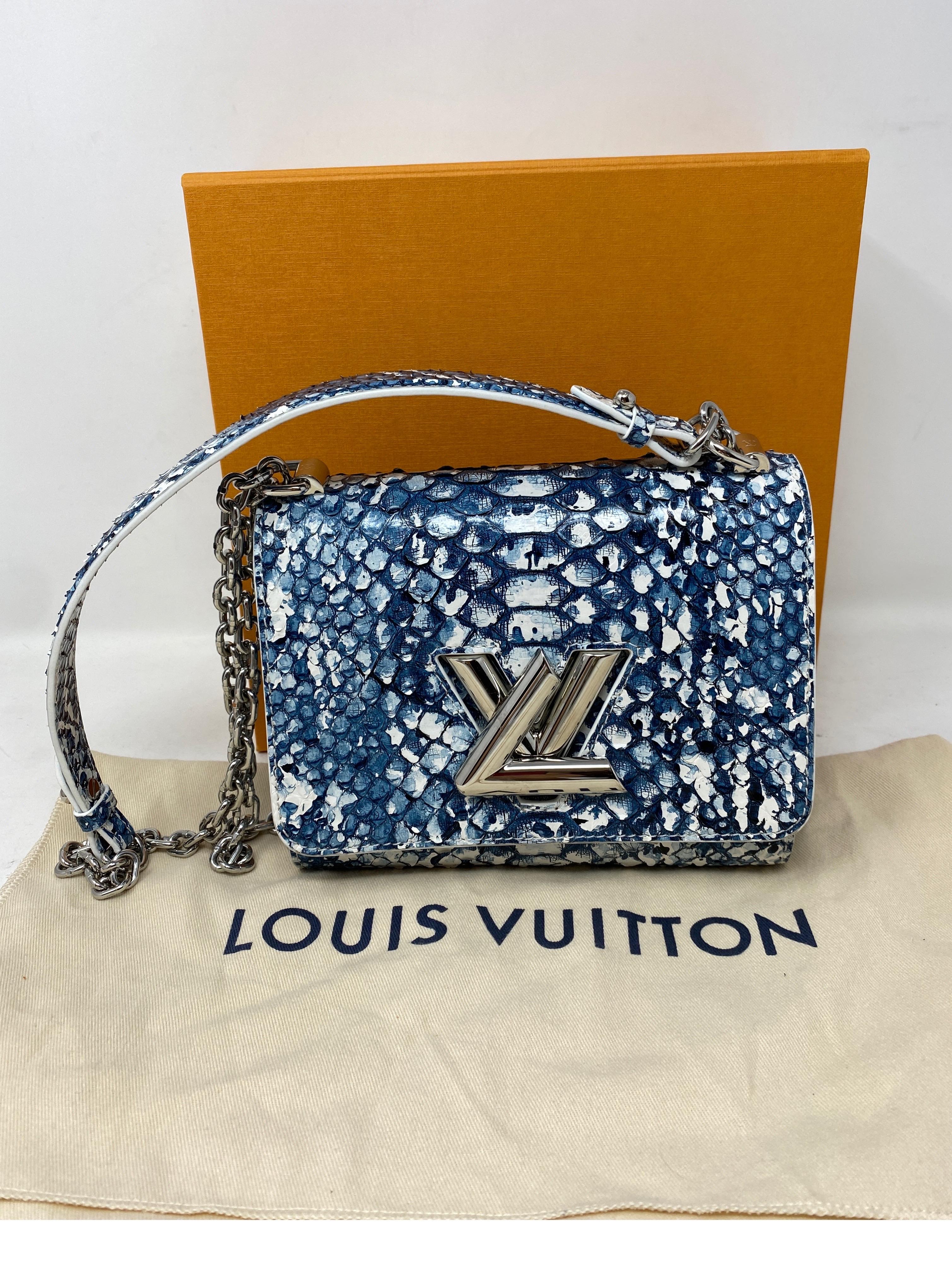 Louis Vuitton Python Twist Crossbody Bag. Mini size can be worn crossbody. Strap can be worn doubled as a shorter shoulder bag. Rare and limited. Python exotic leather bag in excellent like new condition. Collector's piece. Includes original tags,
