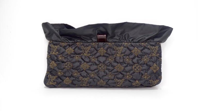 This Limited Louis Vuitton Monogram Clutch is every Louis lovers dream! A beautiful black satin exterior with gold monogram details and gold hardware make this the perfect pop of glam for any outfit! This clutch features a magnetic closure,