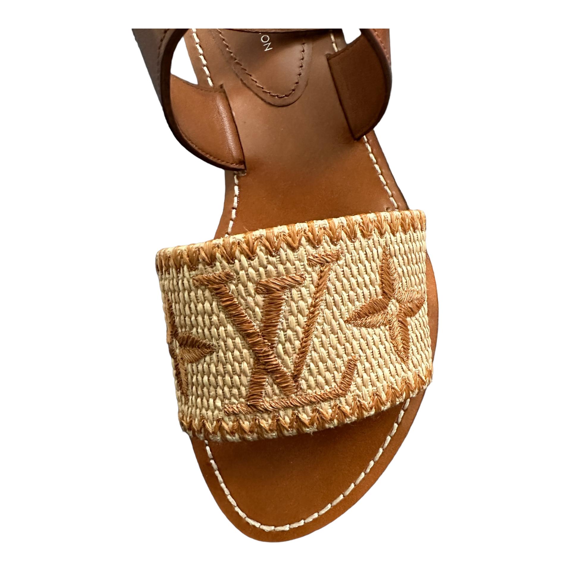 Louis Vuitton
Brand New and Authentic
Sienna Flat Sandal with Ankle Strap 
Each sandal marked 
Size 37.5
Made in Italy
Comes with one LV Dustcover
Monogram Design done in Raffia, in cognac and natural color
Gold hardware, engraved with Louis