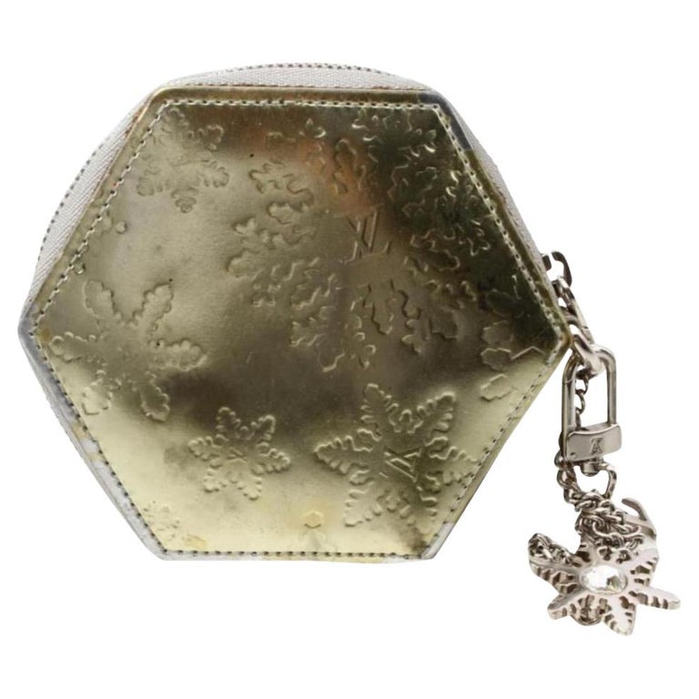 Louis Vuitton Rare porte-monnaie à flocon slowflake doré avec clé de monnaie  et porte-monnaie argenté En vente sur 1stDibs
