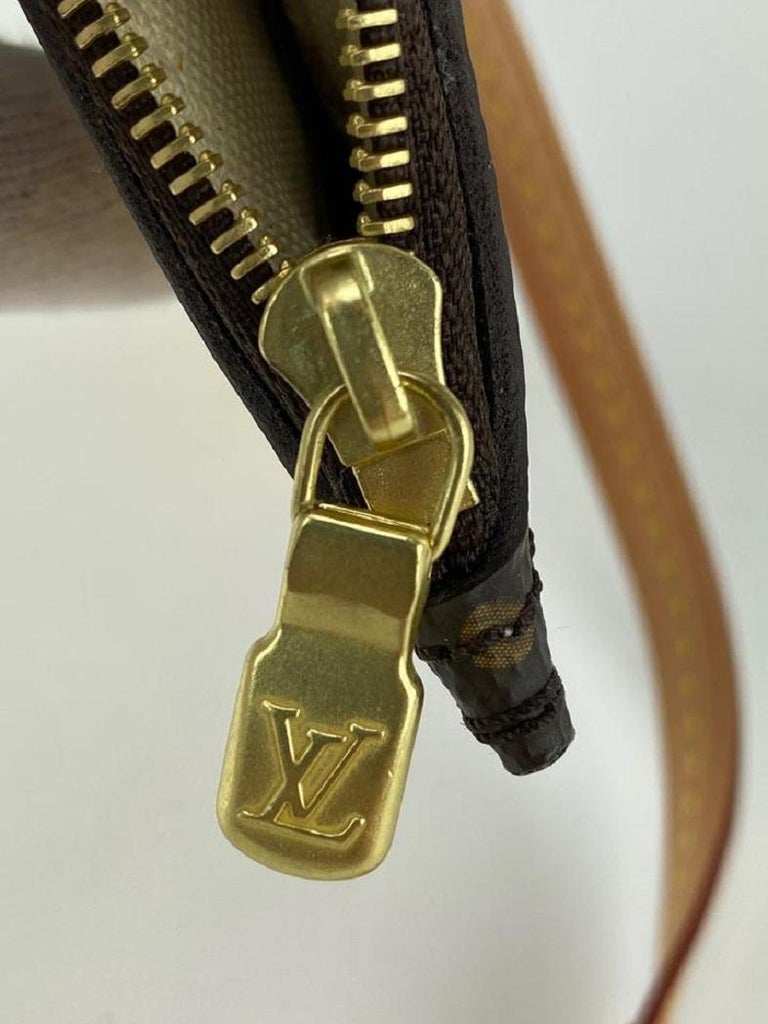 Louis Vuitton Rare Summer Trunks Monogram Neverfull Pochette GM Wristlet Bag  For Sale at 1stDibs  louis vuitton neverfull serial number location,  neverfull wristlet, depose en france etal etranger louis vuitton