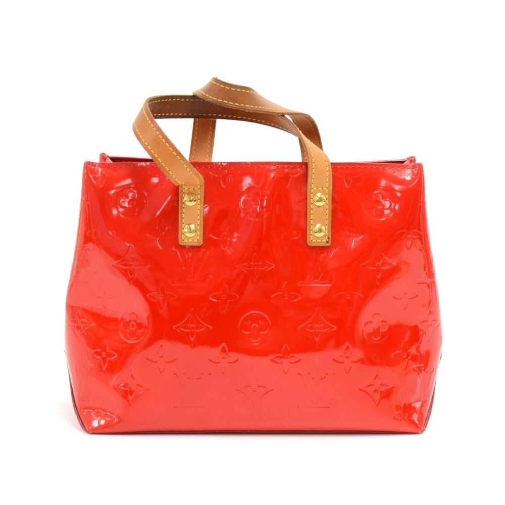 Louis Vuitton Reade PM in Red Vernis leather. Inside has red fabric lining and has 1 zipper pocket. Comfortably carried in hand with cowhide leather handles. Very stylish and cute. SKU: LP203

Made in: France
Serial Number: MI1004
Size: 8.9 x 7.1 x
