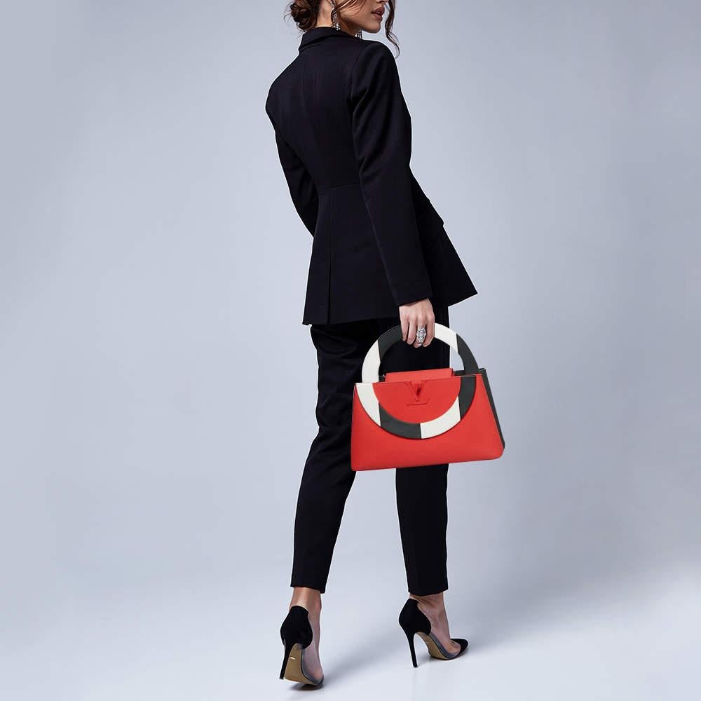 This limited edition Artycapucines bag by Daniel Buren  number 26 of only 50 crafted  heralds the artistry of Louis Vuittonâ€™s Capucines line  named after the Rue des Capucines  home to LVâ€™s first Parisian store. Since its debut in 2013  the