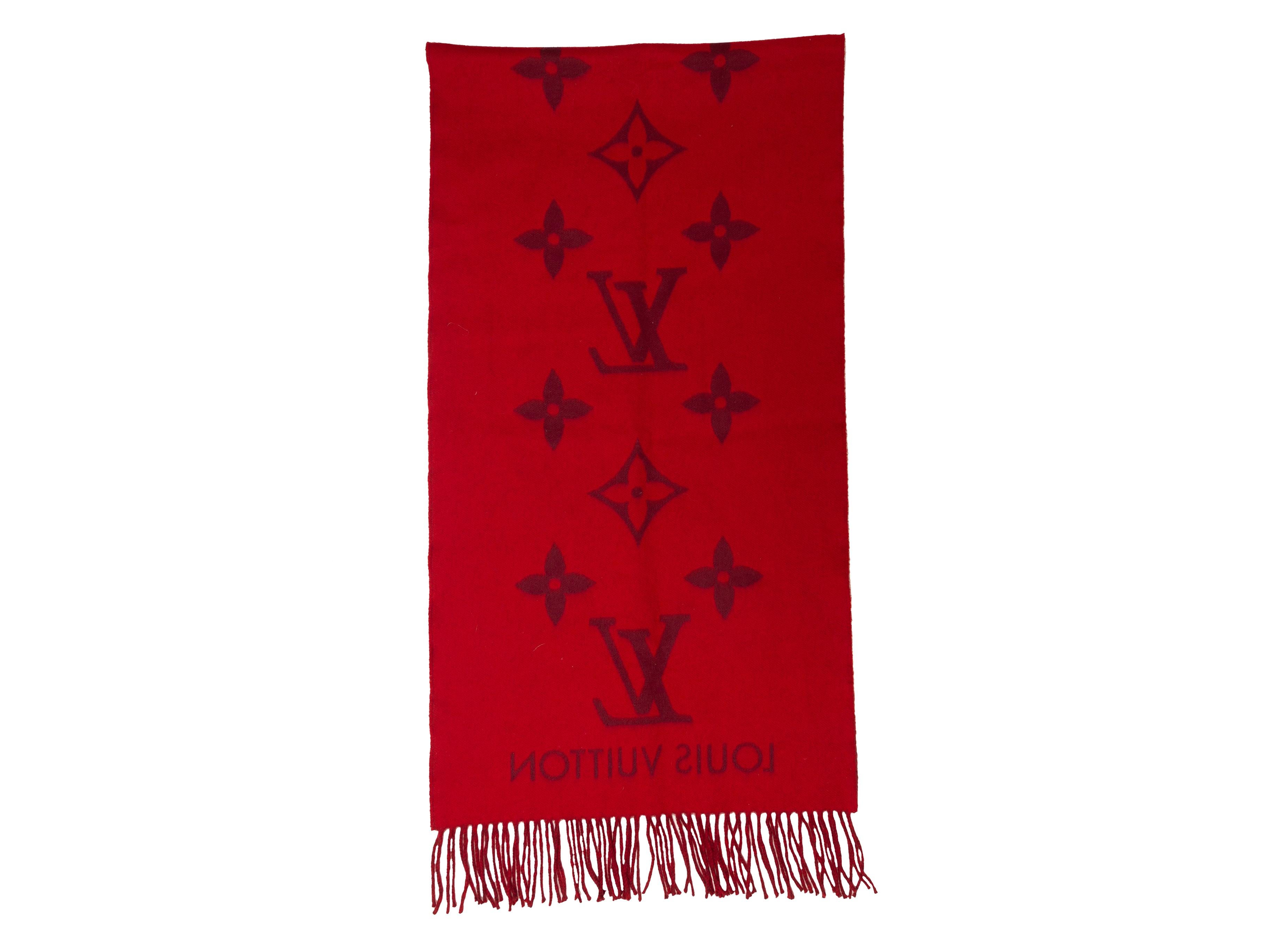 Product details: Red and burgundy cashmere scarf by Louis Vuitton. Intarsia logo throughout. Fringe trim at ends. 66