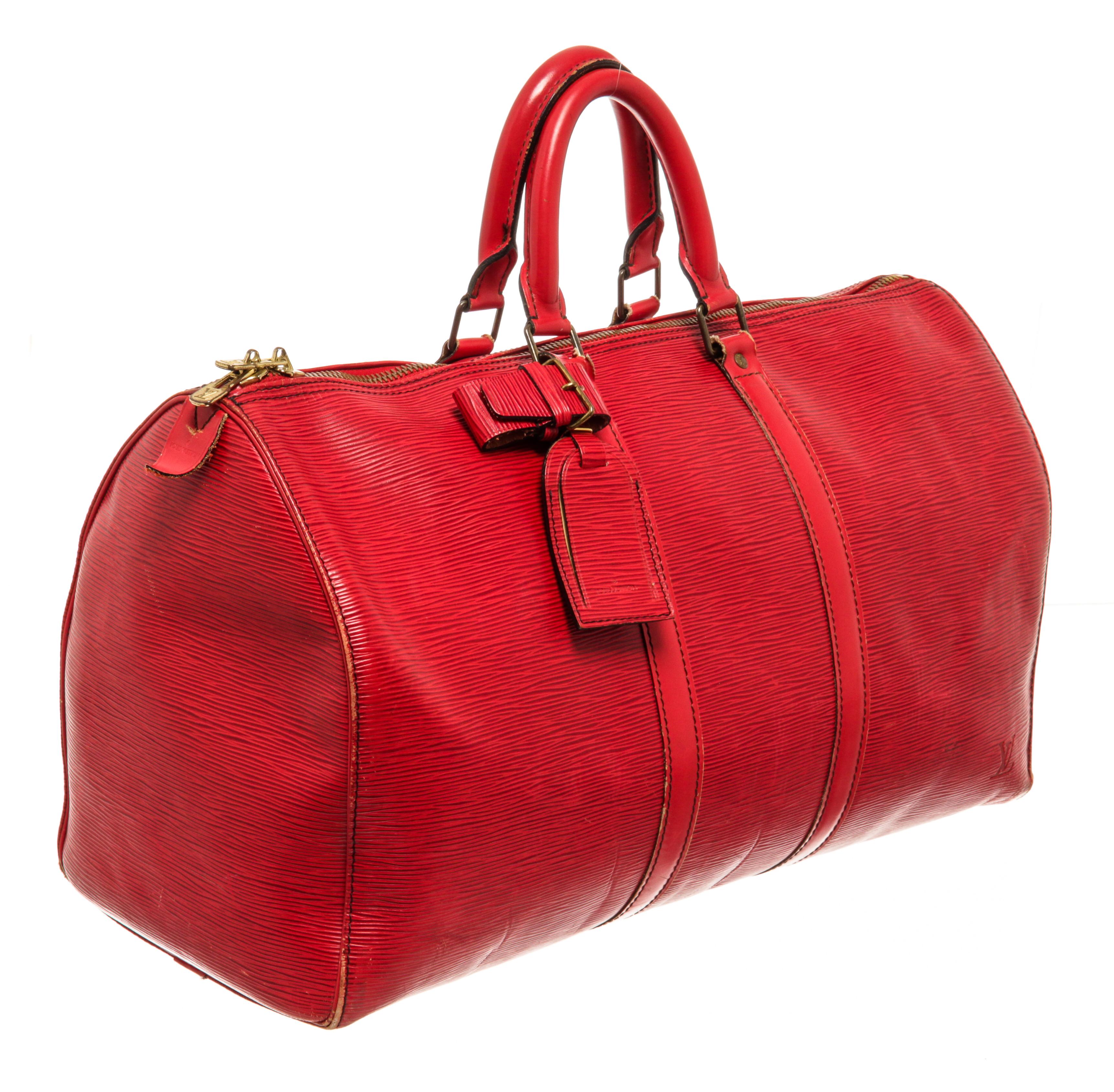 Louis Vuitton Red Epi Leather Keepall 45cm Duffel Luggage Bag with gold-tone hardware, red canvas trim, exterior slip pocket at the side, leather luggage tag, LV embossed logo, red suede lining, dual rolled leather top handles, and zip closure at