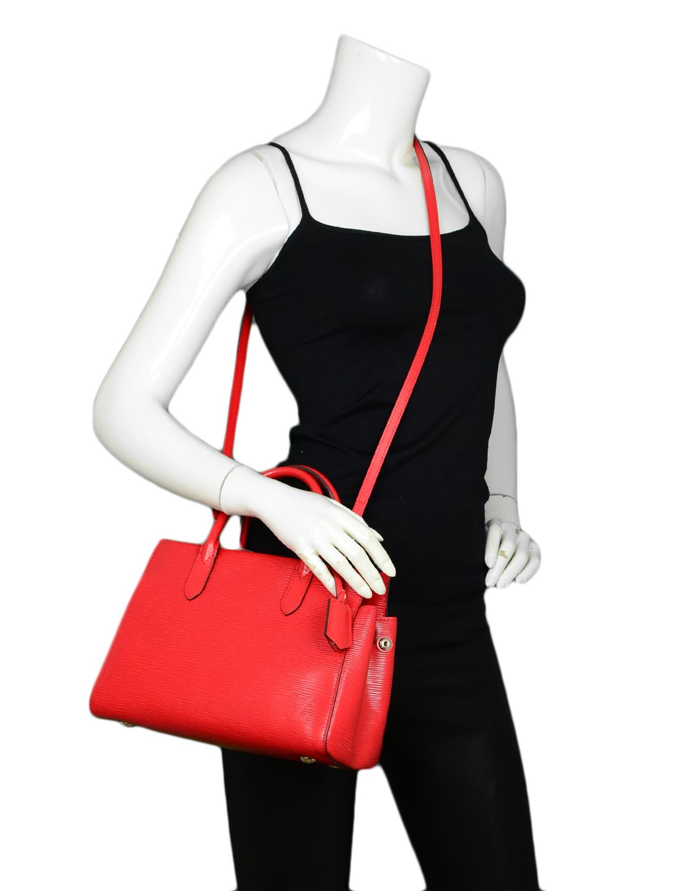 Louis Vuitton Red Epi Leather Marly BB Crossbody Bag 

Made In: Spain
Year of Production: 2014
Color: Red
Hardware: Silvertone
Materials: Epi Leather
Lining: Suede
Closure/Opening: Open top
Exterior Pockets: None
Interior Pockets: Two flat pockets,