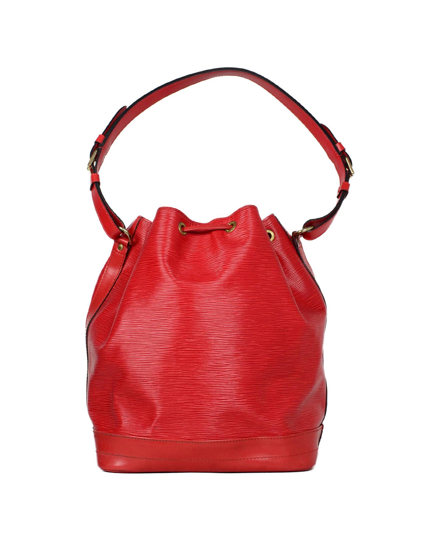 Louis Vuitton Red Epi Leather Noe GM Bucket Bag

Made In: France
Year of Production: 1995
Color: Red
Hardware: Goldtone
Materials: Epi leather
Lining: Red alcantara 
Closure/Opening: Drawstring
Exterior Pockets: None
Interior Pockets: None.  D-ring