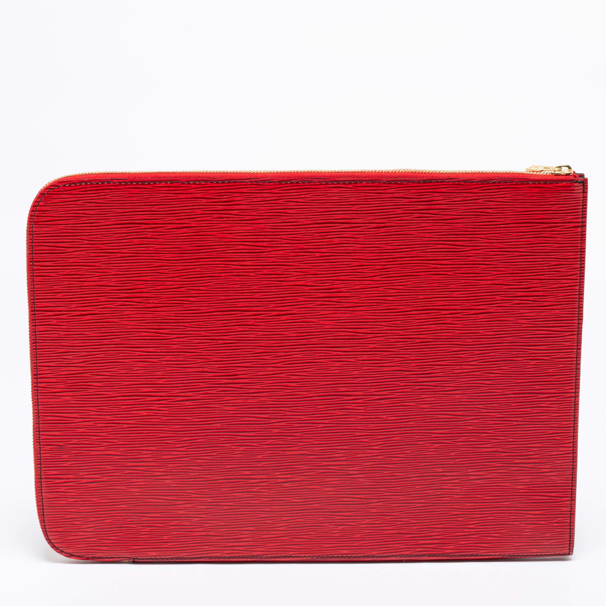 Keep your documents protected and secured with this Louis Vuitton portfolio case. Designed with a sturdy shape, the red Epi leather on the exterior makes it look stunning. It comes with a gold-toned zipper fastening and is sized ideally to store