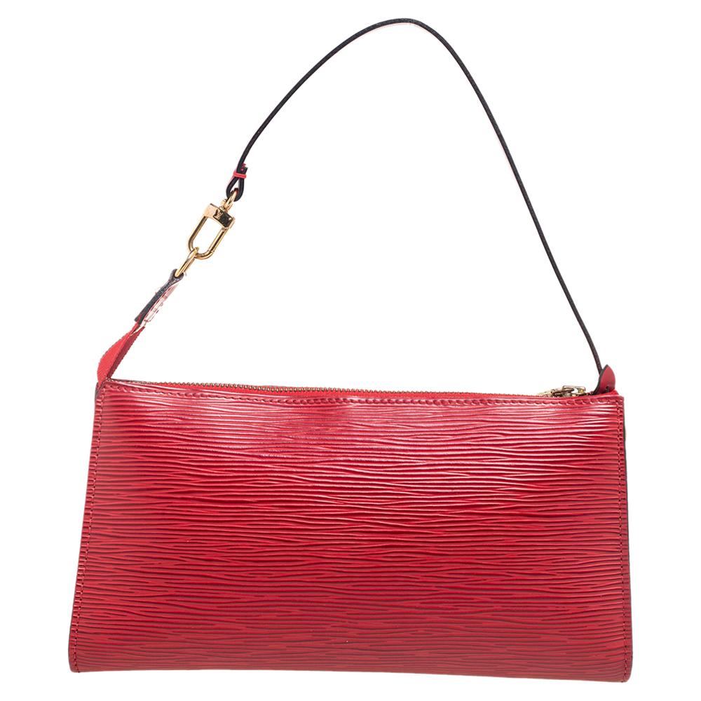 Attractively made into a chic, functional silhouette, this Pochette Accessoires bag from the House of Louis Vuitton is going to be your new favorite handbag! It is made from red Epi leather with gold-toned fittings used to complete its shape. It has