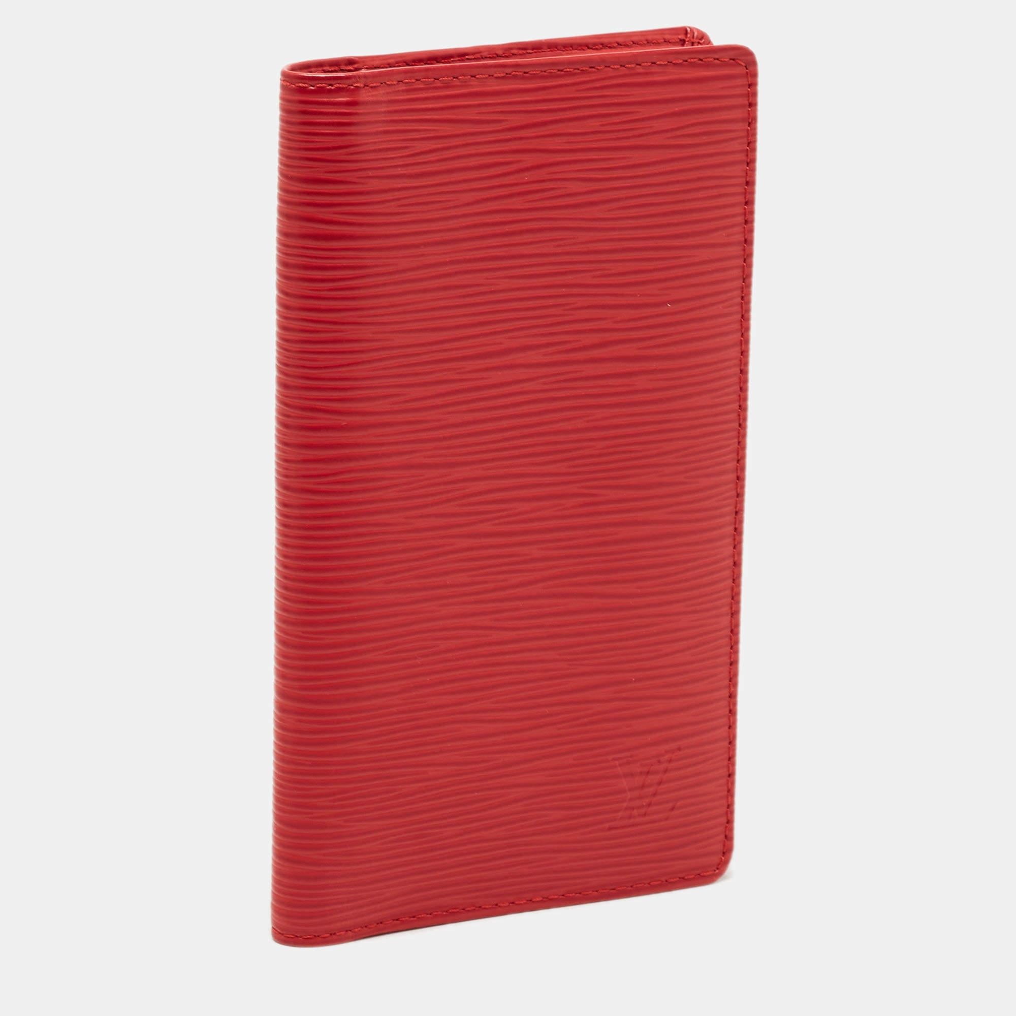 Crafted from vibrant red Epi leather, it features multiple card slots, a spacious pocket, and an ID window. With its sleek design and iconic LV logo, this organizer combines luxury and practicality effortlessly.

