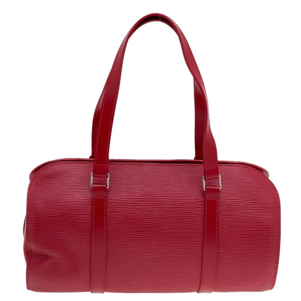 The exclusive LV Soufflot bag, so hard to find in recent times, comes to your wardrobes in an exquisitely designed red shade. Luxuriously crafted from premium quality Epi leather, this bag is a classic way to flaunt a luxe look while you carry your